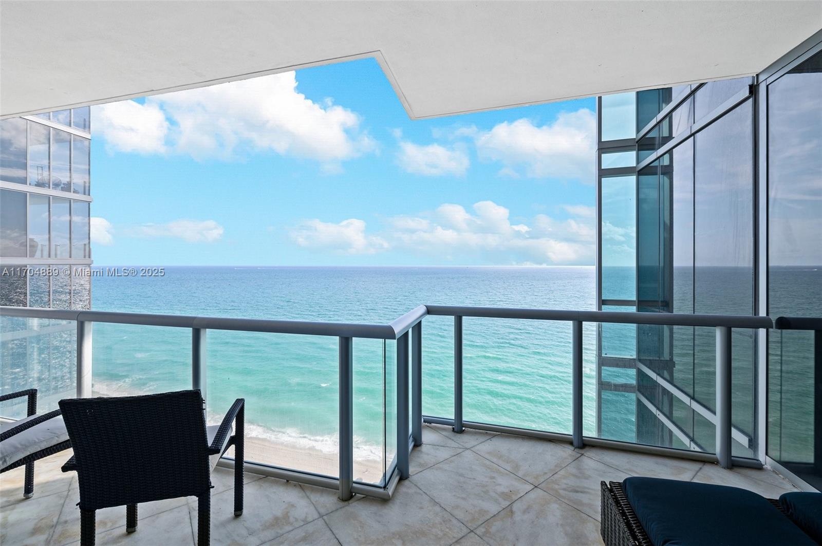 Nestled along the pristine shores of Sunny Isles Beach, this stunning newly furnished 3BD/3.5BA corner apartment at Jade Ocean epitomizes coastal luxury living. As you step out of your private elevator into the grand foyer, you are greeted by an ambiance of elegance and sophistication. The spacious and bright living area features floor-to-ceiling windows that frame breathtaking views of both the Miami skyline and the ocean. The generous kitchen is equipped with top-of-the-line Miele and Subzero appliances, overlooking the flow-through apartment layout.