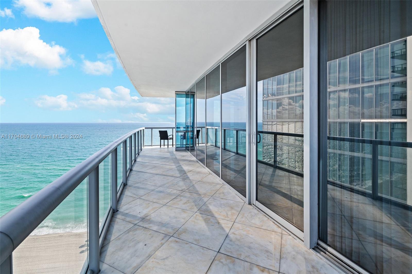 Nestled along the pristine shores of Sunny Isles Beach, this stunning newly furnished 3BD/3.5BA corner apartment at Jade Ocean epitomizes coastal luxury living. As you step out of your private elevator into the grand foyer, you are greeted by an ambiance of elegance and sophistication. The spacious and bright living area features floor-to-ceiling windows that frame breathtaking views of both the Miami skyline and the ocean. The generous kitchen is equipped with top-of-the-line Miele and Subzero appliances, overlooking the flow-through apartment layout.