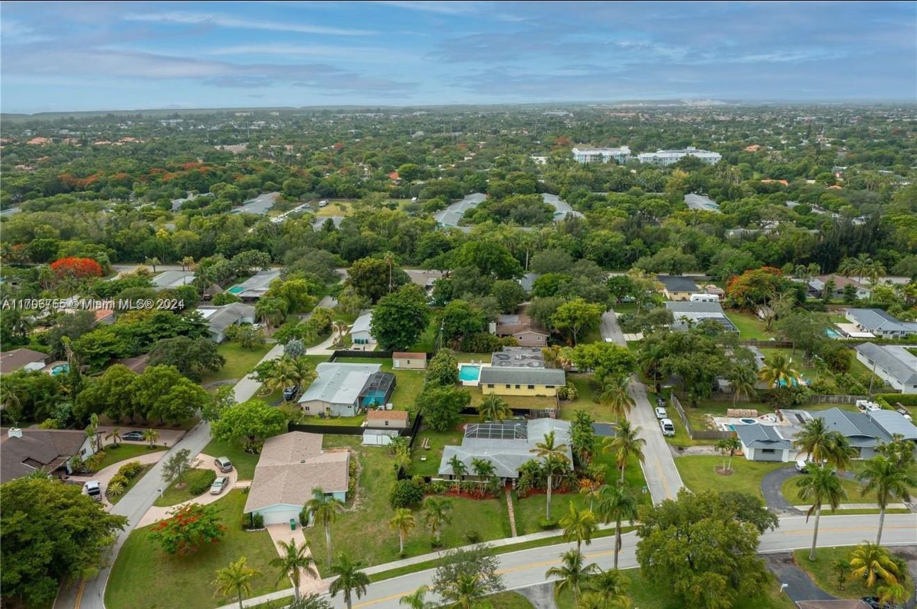 Spacious & Renovated Cutler Bay Gem! Discover this beautifully renovated 3-bedroom, 2-bathroom home, plus a converted garage offering an additional bedroom and bathroom. Located on a sprawling 14,702 sqft corner lot, this property boasts modern upgrades including new porcelain floors throughout, hurricane impact windows and doors, and a new A/C system. Enjoy the luxury of two master bedrooms with walk-in closets, perfect for added comfort. Step outside to your private screened-in pool with a bar, ideal for entertaining. The home is energy-efficient with solar panels and includes two outdoor sheds for extra storage. With its prime location in Cutler Bay, this large, move-in-ready property is perfect for families or anyone seeking a Florida lifestyle at its finest!