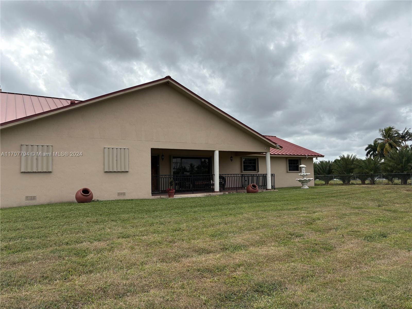 Beautiful 3/2 on 5 Acres with lots of Fruit trees . Back of property faces Redland Golf Country Club. 2 A/C Units,Carport for RV or Boat,Stand by Generator(Generac 32 watts Diesel) 8 year old Metal roof (still under warranty) Shutters, Commercial Alarm System, Electric Gate, 8 Stables with Helpers Quater and Bathroom & Barn.
Must see