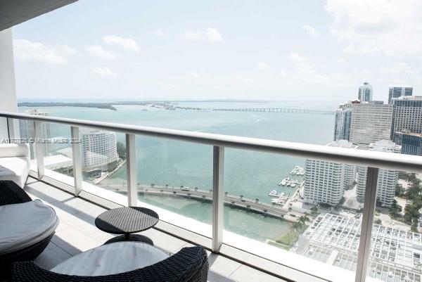 Breathtaking bay view from this 38th floor decorator inspired 2bed + den unit in Tower 2 of prestigious Icon Brickell. Features 24 x 24 white porcelain floors welcomes you into this spacious and airy unit as you look towards Biscayne Bay and the beautiful Brickell skyline. Modern luxurious furniture creates a feeling of serenity from all spaces. Chefs Kitchen, Electric Blackout Blinds, decorator Curtains, built out Closets, and jacuzzi tub.