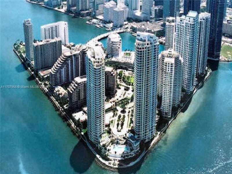 Beautiful, light and bright apartment completely designer remodeled in exclusive Brickell Key. Corner unit with 1200sqft. Beautiful city and water views. Wood cabinets, granite counter tops, stainless steel appliances, marble and wood floors. Resort style amenities and exquisitely remodeled lobby. Best location in Brickell... short distance / or trolley to best shopping and dining. Includes 2 covered assigned parking spaces. A must see!!