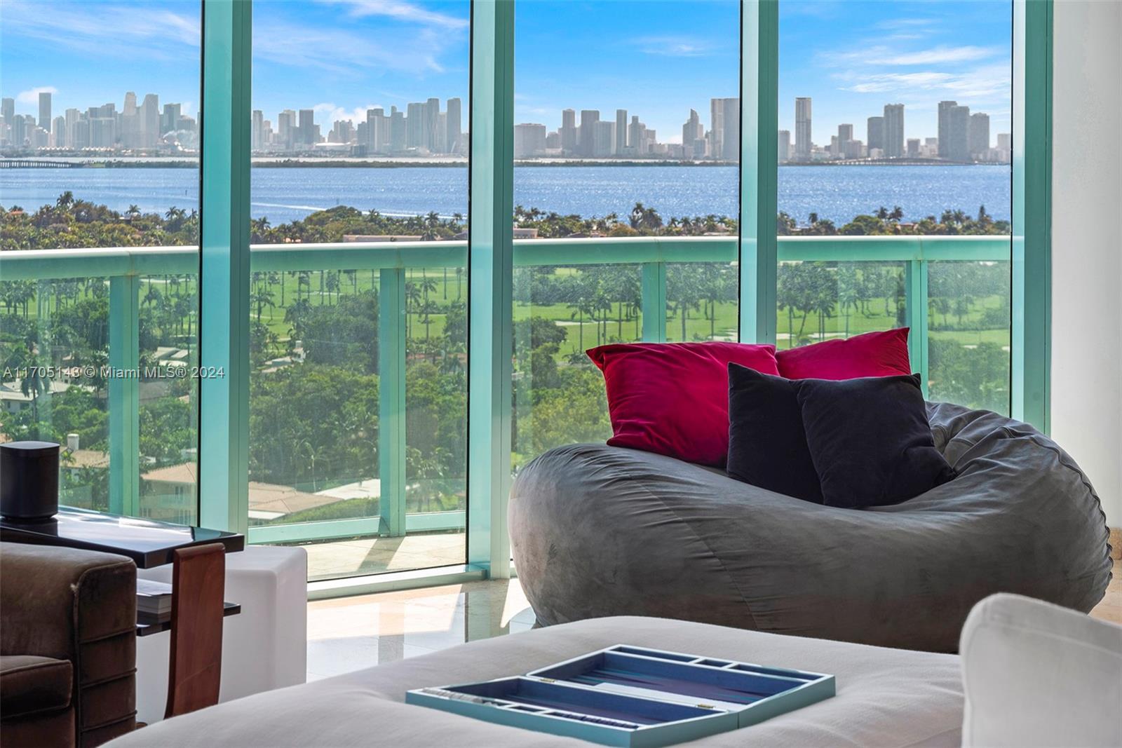 Step into this full-floor penthouse on Miami Beach with breathtaking Ocean and City views. Spanning the entire 19th Floor, this 2600 sq ft home in the sky is a 2/2 with a den/office in a full-service building.  Automated shades, a private elevator, and a smart home system ensure ultimate comfort and functionality. Maximizing natural light, floor-to-ceiling impact windows/doors open to balconies overseeing Miami’s most iconic views.   Bal Harbour and South Beach are only minutes away. The seller is open to renting as well.