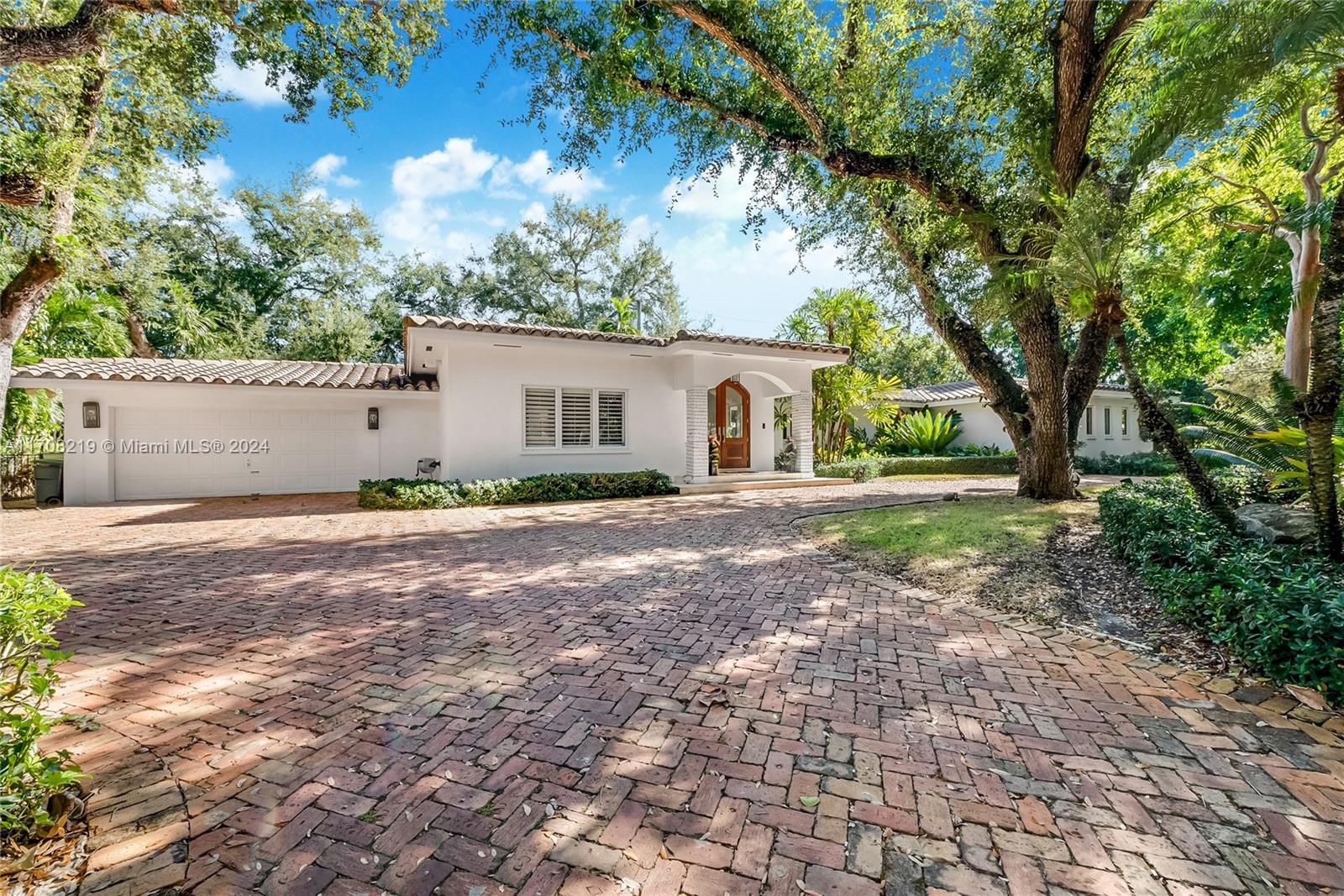 Nestled on a charming tree-lined street in Coral Gables, this updated 4,187 sqft home offers 5 bedrooms, 4.5 bathrooms, 3 outdoor patio living areas and sits on a 15,000 sqft lot. The open layout features spacious living rooms and a remodeled kitchen with a breakfast area overlooking the patio and pool. A formal dining room seats 10-12, while a versatile bonus room serves as a playroom, office, or den. Bathrooms include new vanities, upscale finishes, and glass shower enclosures. Highlights: marble flooring, LED lights, impact glass, walk-in closets, and a primary suite with a private patio and spa-like bath. Updated landscaping, new turf yard, and gated entry. Quiet street in a primate central location just minutes from Coral Gables, Coconut Grove, South Miami, and top schools.