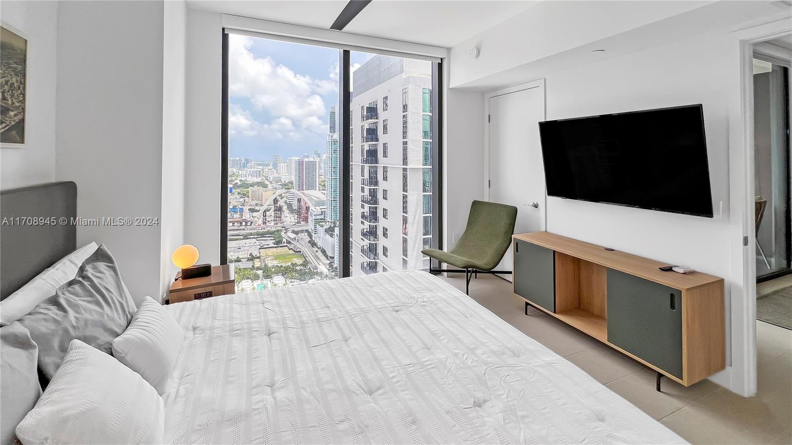 Experience luxury living from the 38th floor of Natiivo Miami. This brand-new, fully furnished 1-bedroom, 1-bathroom residence offers breathtaking, elevated views of the downtown skyline and partial water vistas. You'll enjoy unparalleled perspectives and endless flexibility with short-term rentals allowed on platforms of your choice, or by utilizing the exclusive partnership with the Gale Hotel’s rental program. Perfect for investors or those seeking a second home, this 38th-floor unit offers the freedom to live, rent short or long term, or both. With top-tier amenities, chic restaurants, and the vibrant energy of Miami just an elevator ride away, this is a unique opportunity to own in one of the city’s most dynamic new developments.