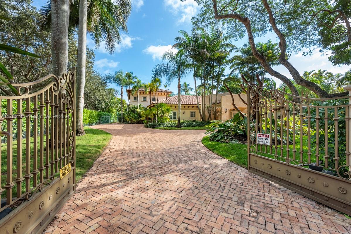 Mediterranean revival in sought after North Pinecrest! Remodeled in 2020, 2-story home on a corner, 32,377 SF lot with private amenities, professionally lit tennis court, saltwater pool, Tiki Hut in your backyard oasis. This 4,030-SF home, teak and marble floors, custom staircase, chef’s kitchen with Viking appliances, quartz counters and pre-wired dining/family room. Master suite features dual custom closets & dual sinks, clawfoot tub, & travertine finishes. Upstairs, 2 suites with walk-in closets, granite & tile accented baths. Cabana suite on main floor with marble floors, built-in closets, & bath with onyx finishes. Hurricane-rated doors & windows, security system, underground FPL lines. A blend of elegance & modern living, offering unmatched lifestyle in prime location.