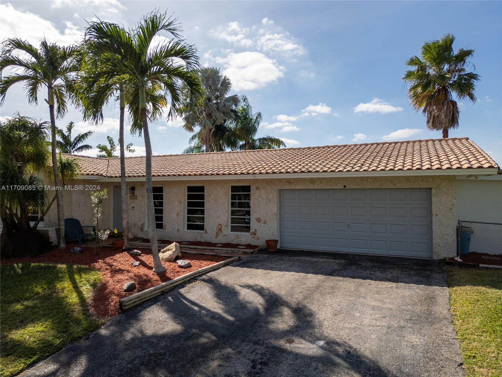 Nestled in the serene and highly sought-after neighborhood of Palmetto Bay, and on a cul-du-sac, this 4/3 offers comfort, style, and convenience. With just over 2,000 sq. ft. of living space (plus a garage under AC) on an expansive 17,640 sq. ft. lot, this property is perfect. Inside, you’ll find a thoughtfully designed layout with spacious bedrooms and living areas. Recent upgrades include a brand-new AC system, a refinished pool, fresh exterior paint, a modernized electrical panel, and a new flat roof over the terrace, ensuring worry-free living. Located near top-rated schools, shopping centers, and dining options, this home combines the best of suburban tranquility and urban convenience. Don’t miss the opportunity to own this beautifully updated gem in Palmetto Bay!