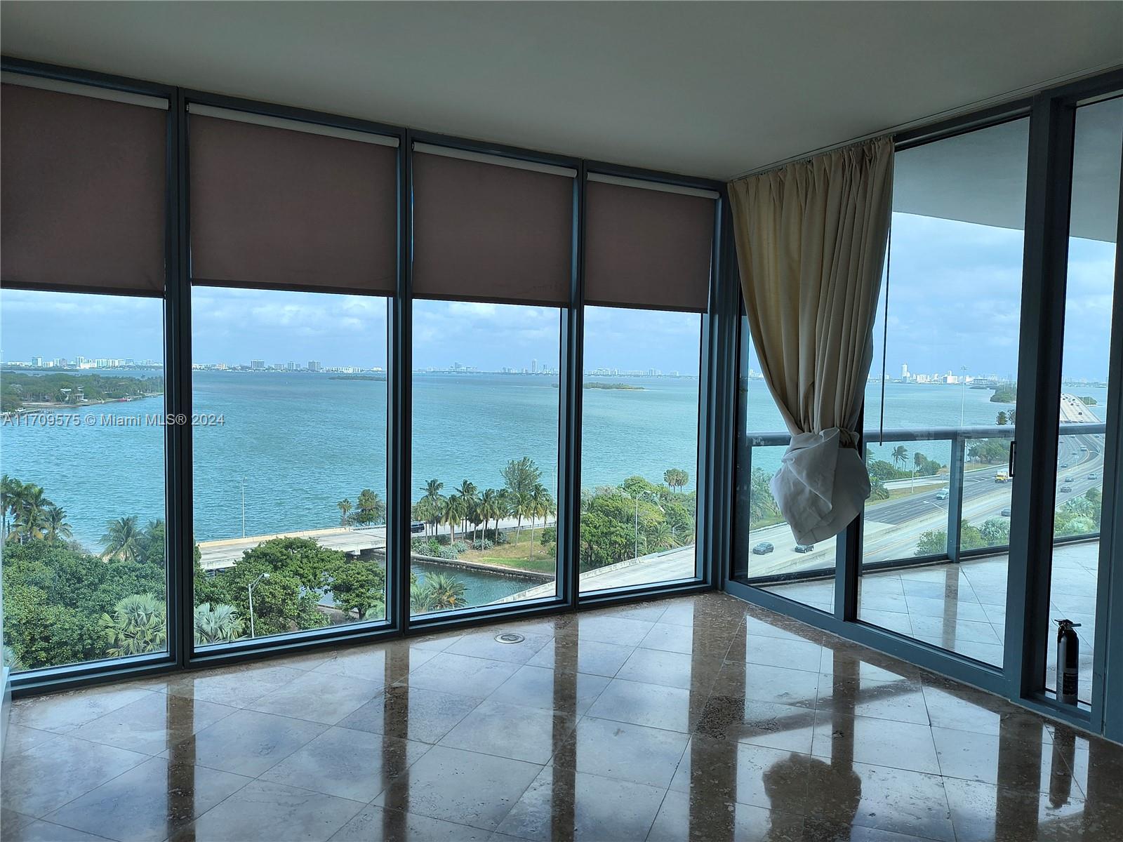 Luxury living with direct water views.  Best unit at Blue on the Bay, large 2.5 bedroom with  direct water views from bedroom and living area, rarely in the market line 10 unit, Floor to ceiling impact windows, marble floors, 24hr concierge, valet parking.