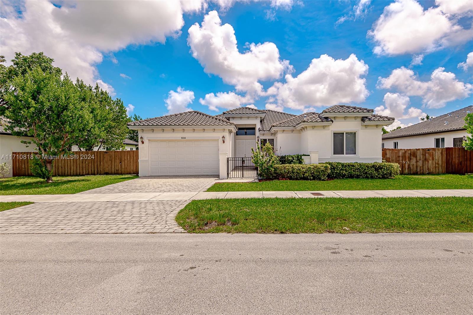 Discover this stunning 4-bedroom, 3.5-bath Mediterranean-style home in the sought-after Palmetto Bay Estates subdivision. Built in 2016, this elegant residence offers 2,254 sq. ft. of living space on a 9,720 sq. ft. lot with room for a pool. Inside, enjoy ceramic tile floors, high ceilings, a welcoming foyer, spacious family room, and eat-in kitchen counter perfect for entertaining. Additional features include hurricane shutters, sliding windows, a laundry room, walk-in closets, and a double-car garage with extended driveway. The cement tile roof adds lasting appeal, and the home is conveniently close to shopping centers and public transportation. Schedule your showing today!