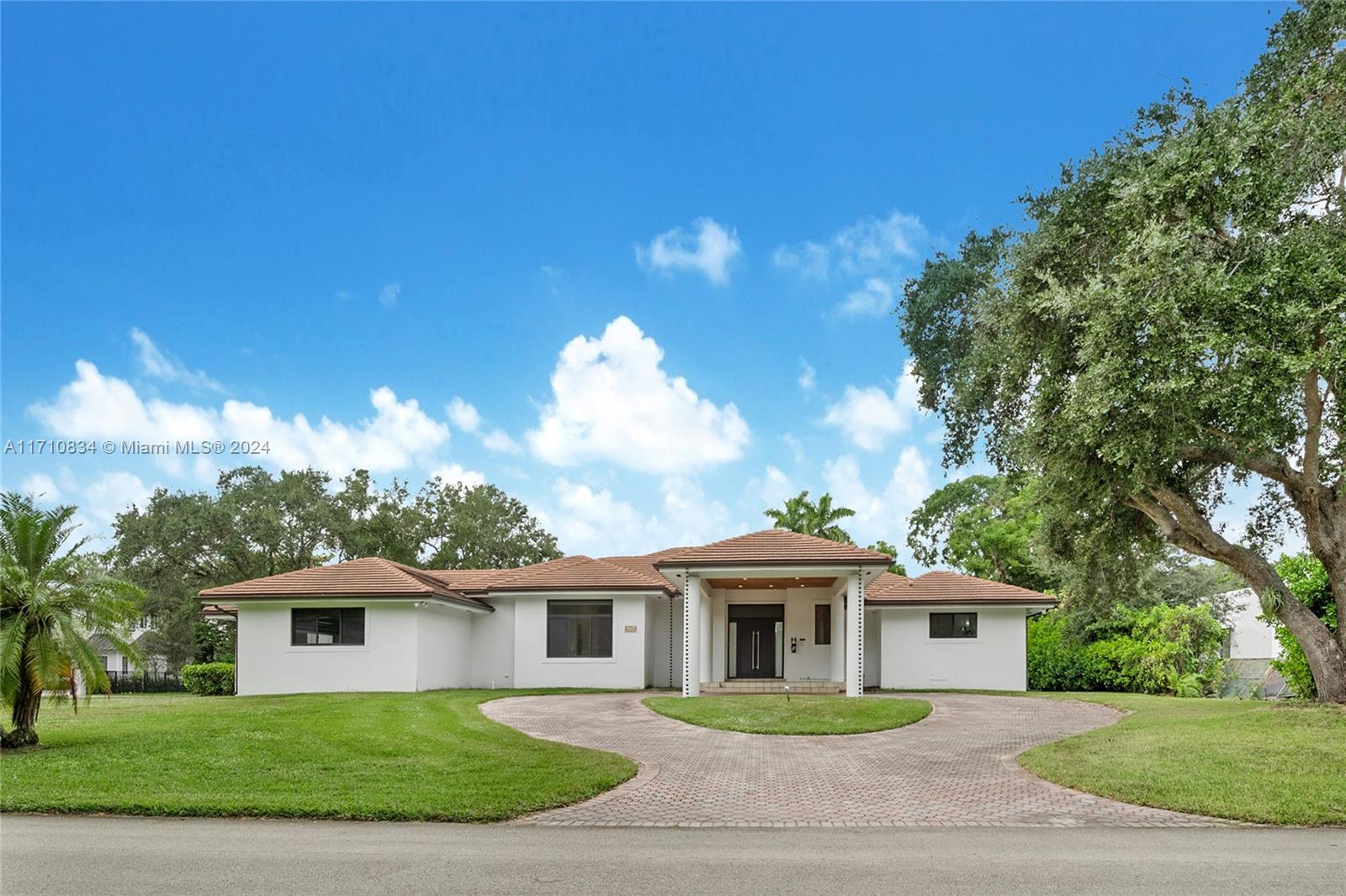 This stunning home, built in the late '90s, boasts a bright and airy floorplan with soaring ceilings.Situated on a peaceful corner lot, it offers a private,well-positioned entrance with a porte-cochere for added elegance.Enjoy breathtaking sunset views from your expansive backyard, complete with a large pool, perfect for relaxation or entertaining.The open layout seamlessly connects the family, dining, and kitchen areas, creating an ideal space for gatherings.The generous master suite features separate his-and-her water closets, offering convenience and luxury.Outside, mature oak trees and lush landscaping surround the yard, providing plenty of space for both play and entertainment.Located near top-rated schools, this home combines comfort and convenience for the perfect living experience.