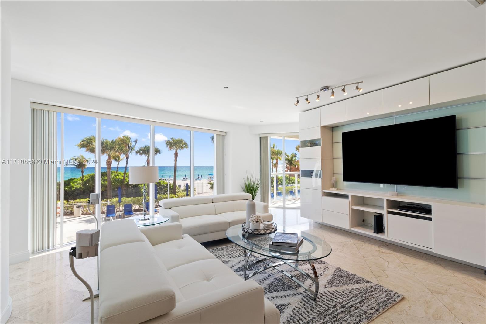 Indulge in the ultimate coastal lifestyle in this spacious 3-bedroom, 2.5-bathroom condo at the prestigious Millennium Tower. With breathtaking ocean views and direct beach access, you'll feel like you're on vacation every day. The open floor plan boasts floor-to-ceiling windows, creating a bright and airy atmosphere. The gourmet kitchen is perfect for entertaining, while the private balcony offers a serene space to relax and enjoy the ocean breeze. Residents of the Millennium Tower enjoy a wide range of amenities, including a state-of-the-art fitness center, spa, infinity pool, and 24-hour concierge service.