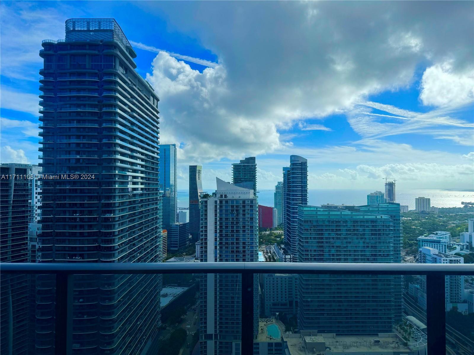 Breathtaking, unobstructed views await! This stunning 1-bedroom + den, 2-bath unit in Brickell Heights East Tower soars above neighboring buildings like Millecento and Axis, offering unmatched south-facing vistas that stretch to Homestead on a clear day. Unlike lower-floor units in the 05 line, this top-floor gem delivers a rare, uninterrupted perspective. Floor-to-ceiling windows flood the space with natural light, showcasing its sleek design and high-end finishes, including a Sub-Zero refrigerator and Bosch appliances in the gourmet kitchen. Tenant-occupied until December 29th, 2025—a fantastic investment with income in place. 3D virtual tour available. Schedule a showing and experience this one-of-a-kind view!