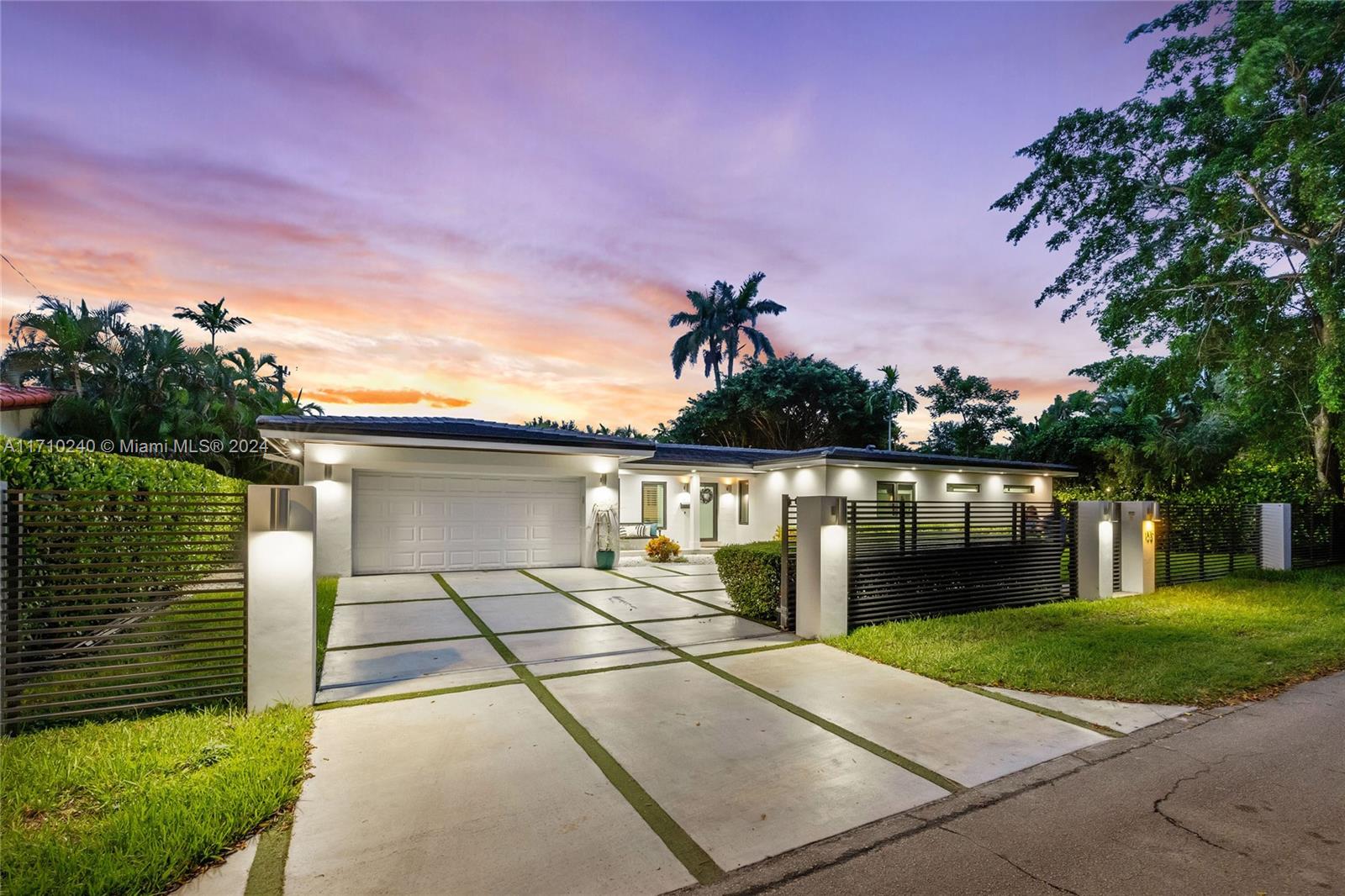 Located on a serene and private drive in South Coral Gables, this beautifully finished home features a large
entertaining space with living, dining and family rooms connecting seamlessly to the covered patio w/ summer
kitchen, all overlooking the expansive back yard that features an easy-turf lawn & stunning heated pool w/ sun
ledge and led lighting. The home's primary suite features his/her closets, shower & dual vanities with exquisite
finishes. The 4 add'l bedrooms share 2 full baths, add'l full bath has access to pool. Well appointed interior kitchen
and summer kitchen has grill & stovetop for al-fresco cooking. Add'l features: laundry room, 2 car garage,
security system, concrete driveway, impact glass, 2023 roof, new plumbing, 2022 a/c system. Minutes to Grove
dwntwn & schools