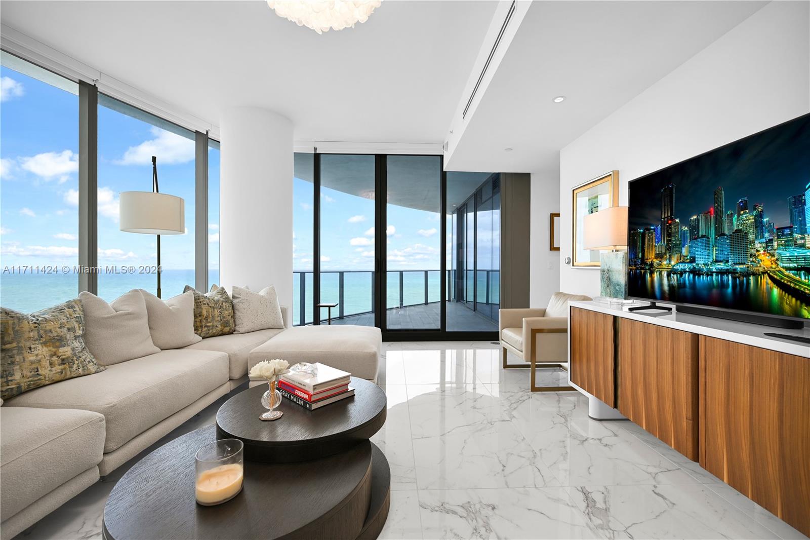 Experience luxury living in one of South Florida's most coveted buildings! This stunning 3-bedroom + den + service room, 4.5-bathroom residence at The Ritz-Carlton Residences, Sunny Isles Beach, offers breathtaking direct ocean and Intracoastal views. Featuring premium Gaggenau appliances, unparalleled five-star service, and an exceptional team of staff, this home boasts impeccable design and world-class amenities.