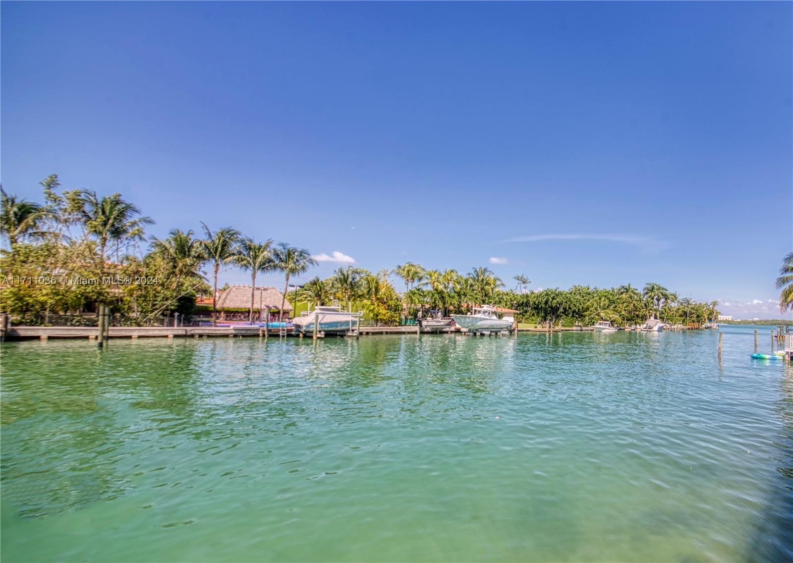 Inviting and spacious waterfront condo in Bay Harbor Islands with 2 bedrooms, 2 bathrooms and a large, open balcony. The beautifully renovated kitchen has granite countertops & stainless steel appliances and opens to a huge living area. The primary bedroom has an en suite bathroom & 2 walk-in closets. Enjoy peace of mind with hurricane impact exterior windows/doors. This well-maintained boutique building has completed its 40-year recertification, has reserves, and features newly upgraded glass balconies & a new roof. Amenities include covered parking, a waterfront saltwater pool, a gym, sauna, doorman, community dock, paddle board launch, electric car charger & extra storage. Walk to Bal Harbour Shops, houses of worship, shopping, dining, parks + more! Zoned for A-rated Bay Harbor schools.