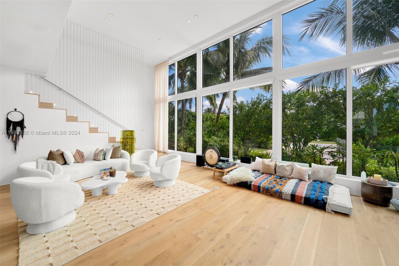 Step into a world of luxury in this stunning Miami Beach home, completed in 2016 by Todd Glaser & Domo Architecture. This smart home features dramatic high ceilings, modern wood floors, and a bright open floor plan with designer finishes. The top-of-the-line kitchen flows seamlessly into the second floor, where 4 en-suite bedrooms open onto a long balcony, complemented by a serene hallway lounge. Situated on a gated 9,000 SF lot with lush tropical landscaping, the property boasts a creative L-shaped heated lap pool, a covered summer kitchen, and ample space for entertaining. No feature was overlooked, from impact windows and remote-controlled shades to a salted/heated pool. Ideally located near Sunset Harbour’s vibrant cafes, restaurants, and shops, with beaches just a short walk away.