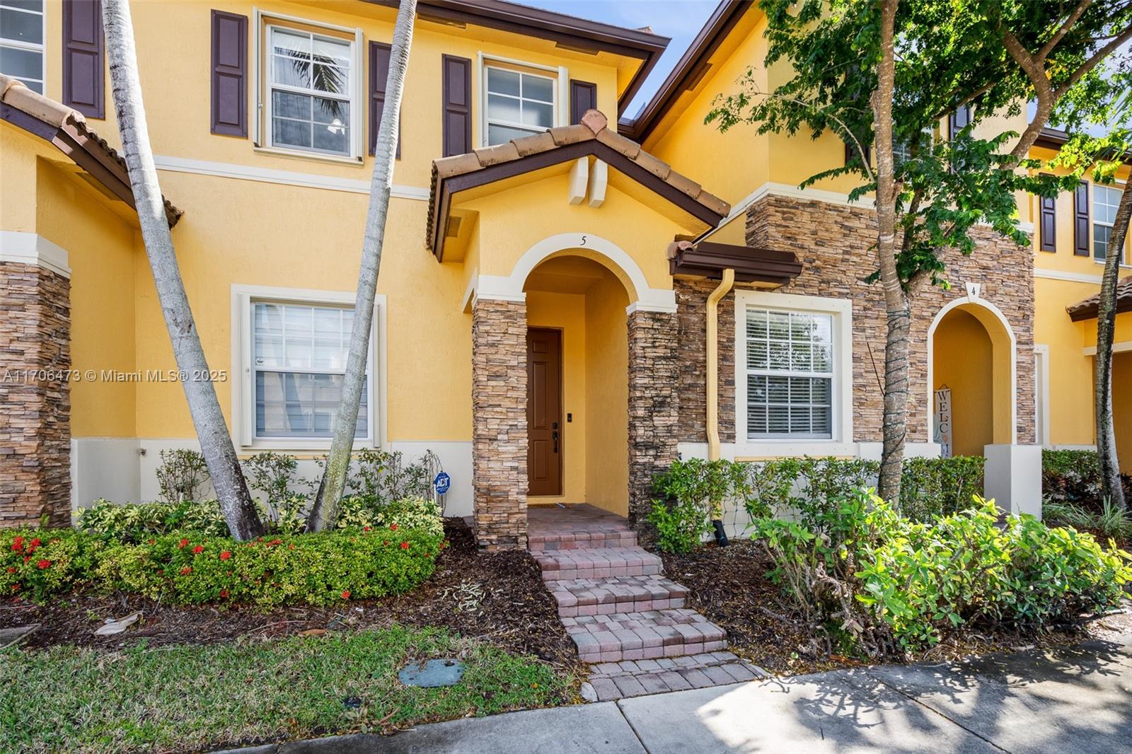 This meticulously maintained 2-bed, 2.5-bath townhouse in The Shores at Lakes by the Bay shows true owner pride. The first floor features tile flooring and a remodeled half bath, while the second floor has Laminate floors. Enjoy new stainless steel appliances, zebra blinds, and accordion hurricane shutters throughout. The unit includes two assigned parking spaces right in front and a fully gated backyard. Each bedroom has its own private bathroom and walk-in closet. The community offers excellent amenities like a pool, gym, and clubhouse near top-rated schools. Washer/dryer in unit; the community offers Rover security. The HOA fee is $141/month, and the Master Association fee is $39/quarter.