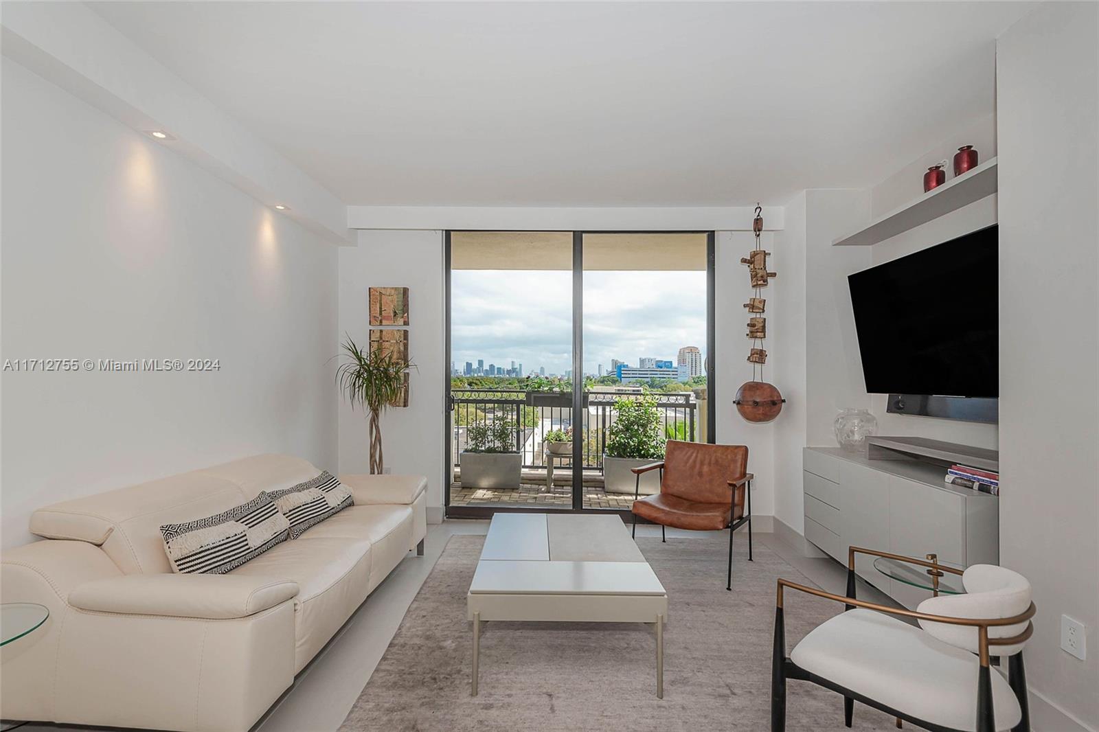 Fully renovated and smart condo with large outdoor terrace at 55 Merrick. This unique space will not disappoint, too many upgrades and details to list, you will not be disappointed. This is a one-of-a-kind property with over 800 sqft of outdoor space and views of downtown Miami. Unit has 2 assigned parking spaces as well as 2 assigned storage spaces.