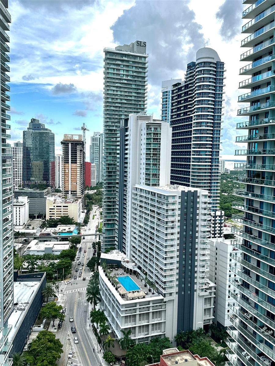 Enjoy this lovely corner condo in Flatiron at Brickell, which features 2 bedrooms, 2.5 bathrooms and a wraparound balcony with views of the city skyline. Beautifully furnished unit like new with everything included in the pictures. Top of the line appliances, huge walk-in closets in both rooms, and an extra pocket closet in the Master Bedroom. Italian ceramic floors and Italian wooden doors the elegance is best to be seen in person. Just bring your toothbrush and enjoy living in the best Brickell has to offer. Located in one of Miami's tallest residential structures, facing the southeast corner. Live and play in this opulent structure with the best amenities in the neighborhood: The 64th-floor Sky Club rooftop features a pool with 360-degree views of Miami. All set to move in.