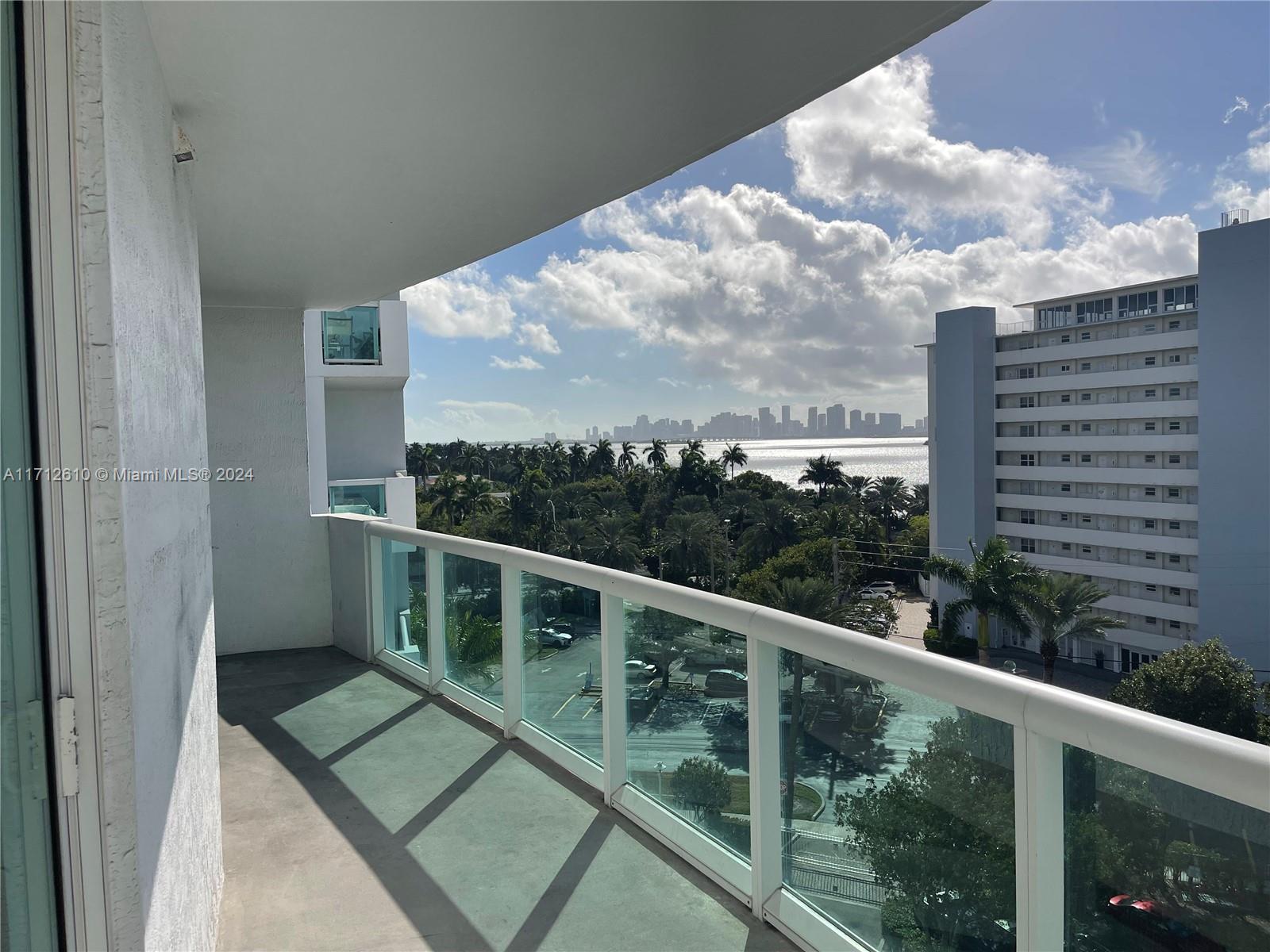 Spectacular Biscayne Bay views including views of Downtown Miami from this spacious 2 bed 2 bath split bedroom floor plan. Walk into the wide open living/ dining area with open kitchen featuring granite countertops and SS appliances. Huge master bedroom with ensuite bathroom with whirlpool tub, separate shower, double sinks and walk in closet. Great balcony for your enjoyment accessible from both living area and master bedroom. This luxury condominium offers 2 pools, expansive gym with looker rooms and sauna, clubhouse, 24 hr security, free valet parking, 1 covered parking space, and opportunity to rent or purchase boat dock from private marina if available. Excellent location in North Bay Village between mainland Miami and Miami Beach and all the awesome things  these areas have to offer.