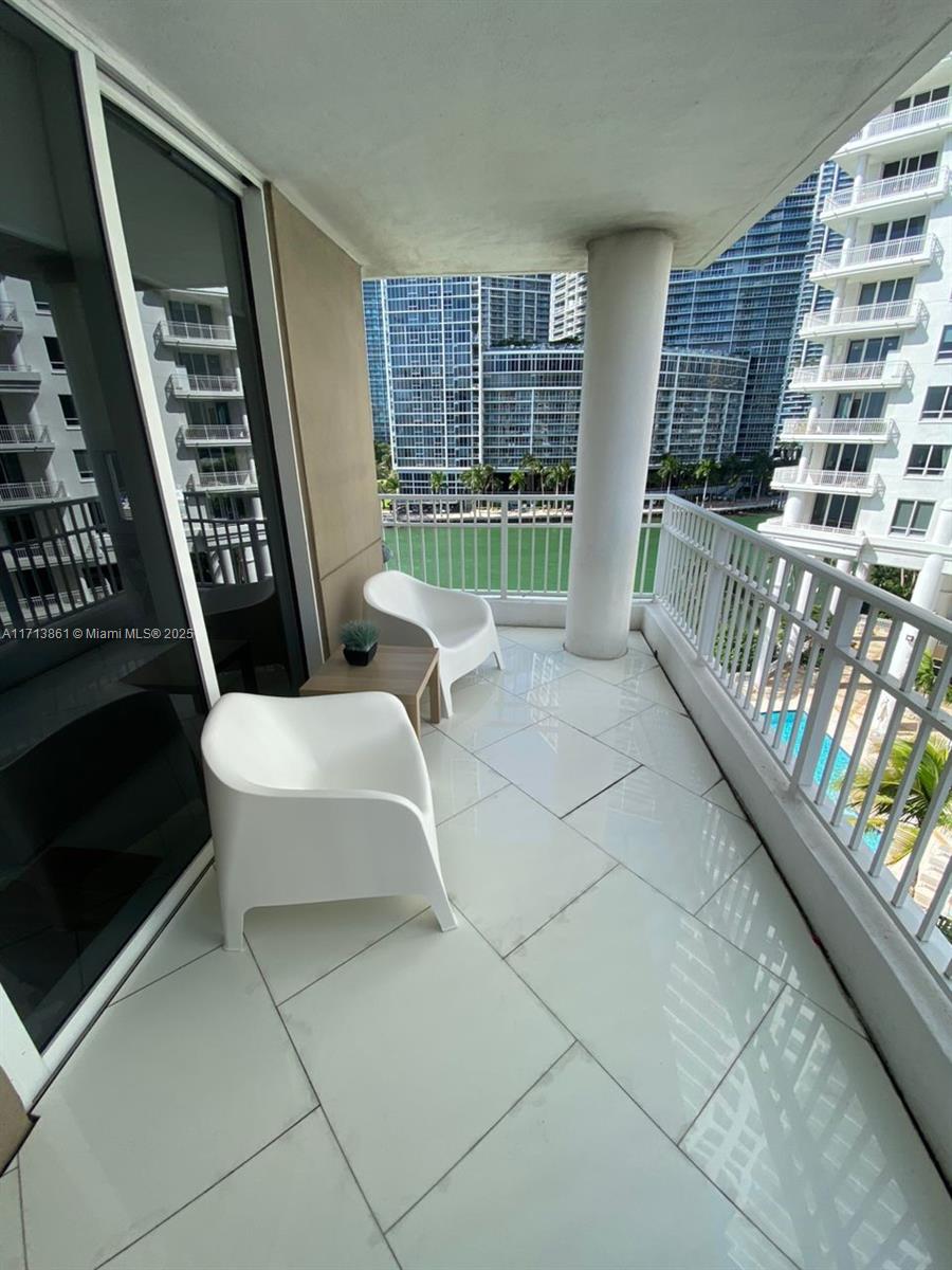 Fully remodeled corner unit in the Courvoisier Court Condo located in the prestigious Brickell Key. The unit has a large balcony, sweeping views of Brickell avenue with 2 beds, 2.5 baths, ocean views and open layout, 1230 Sqft. One of the best location within the exclusive island. Minimalist furnished with impeccable finishes. Porcelaine floor. 
The structure designed for comfort structure privacy near by many attraction to what the Brickell Miami area has to offer, 15 minutes drive to the international airport and south beach. The tenants enjoy ONE STORAGE, assigned covered parking 24/7 security guard. Courvoisier Courts offers 5 star amenities including spacious gym with brand new equipment, indoors squash courts, 24/7 concierge, valet service and amazing pool area with water views.