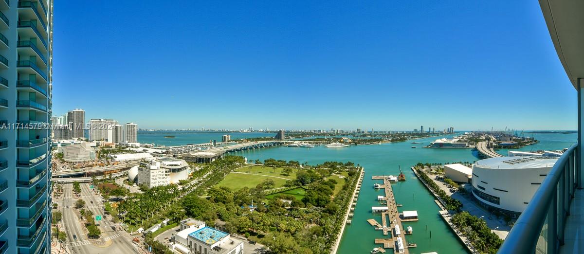 Experience breathtaking and unmatched water vistas from the 25th floor of this remarkable condo! Offering a generous layout with one bedroom and one-and-a-half bathrooms, this unit boasts a fully upgraded master bathroom and includes convenient amenities like a washer and dryer. Assigned parking adds to the convenience. Step out onto the expansive balcony to take in the stunning views of Biscayne Bay, accessible from the living room, kitchen, and bedroom. Located centrally, it's just a short drive to the beach and airport. Marina Blue ensures peace of mind with 24/7 security and offers a range of amenities including concierge services, two pools, a jacuzzi, and a gym. Situated mere steps away from attractions such as the Perez Art Museum, basketball stadium, Bayside Market.