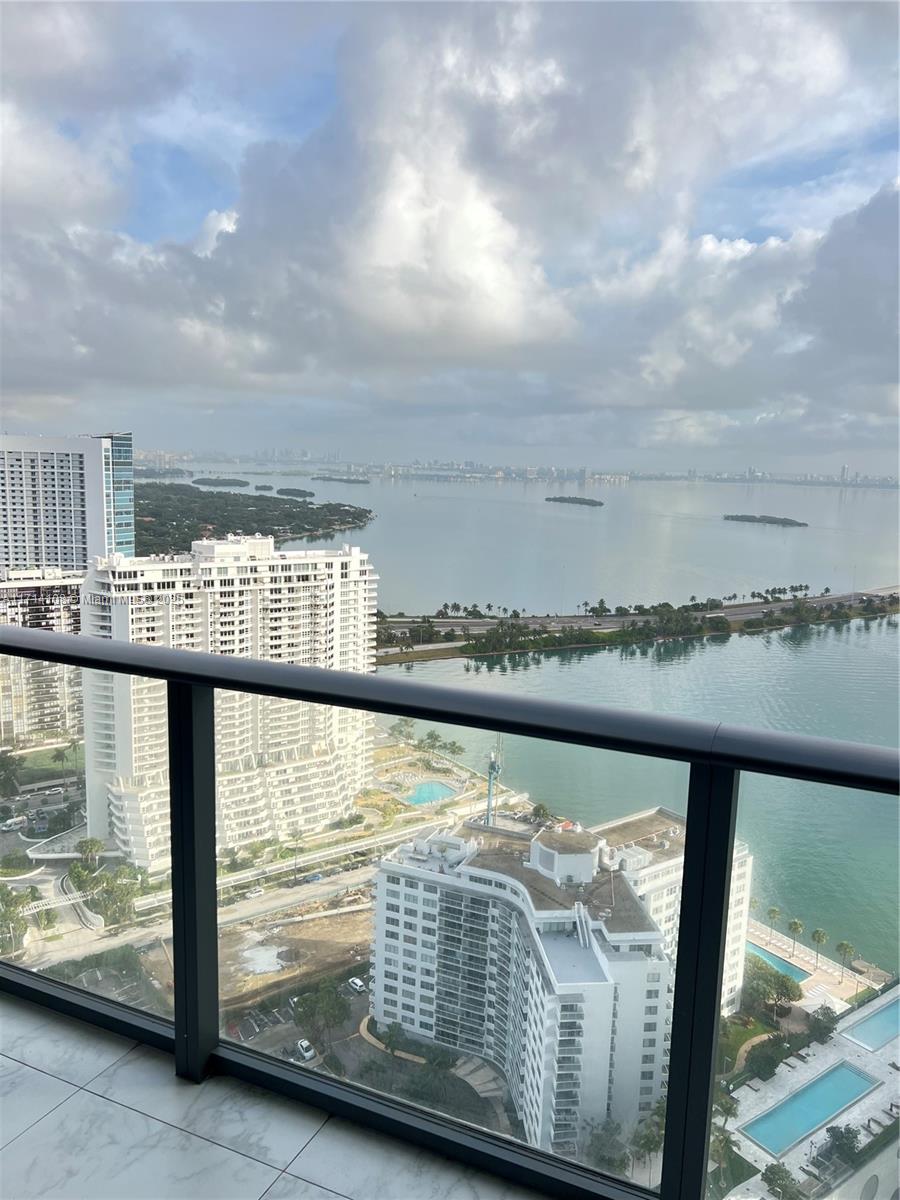 Fully Furnished 1-Bedroom, 1.5-Bathroom Condo with Breathtaking Bay Views. Located on the 36th floor of a modern high-rise in the vibrant Edgewater neighborhood. Enjoy panoramic views of Biscayne Bay, creating a tranquil escape right from your living room.The open-concept living area, featuring sleek laminate floors throughout, offers a bright, airy space perfect for both relaxing and entertaining. Large floor-to-ceiling windows flood the home with natural light, while showcasing the spectacular bay views. The fully-equipped kitchen includes high-end Bosh appliances, modern cabinetry, and elegant finishes. The building offers top-notch amenities, including 2 pools, fitness center, concierge service, and more, for a lifestyle of ease and luxury. May Consider Short Term Renters!