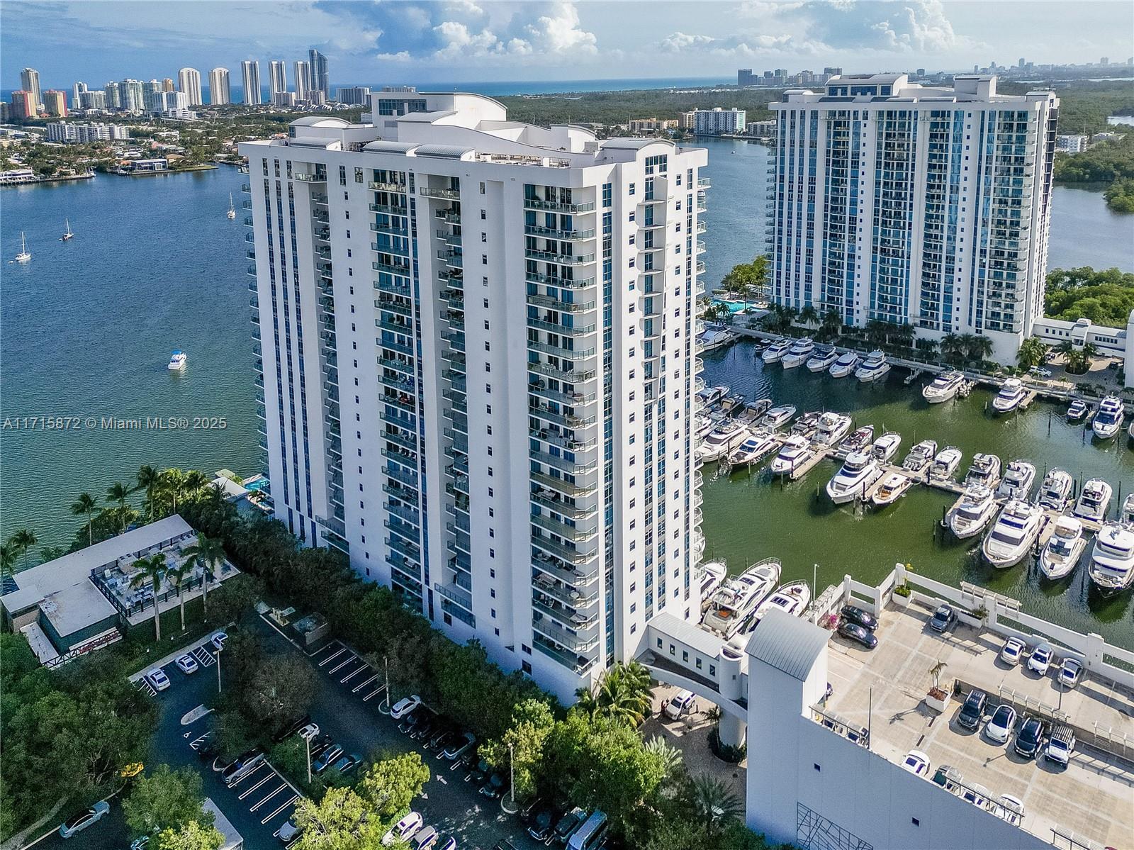 Experience luxury waterfront living at Marina Palms! This stunning 2-bedroom, 2-bath condo spans 1,962 sqft, offering breathtaking bay views and modern elegance. The gourmet kitchen features custom cabinetry, high-end appliances, and a chic glass-tiled backsplash. Enjoy the open-concept living area with polished floors and floor-to-ceiling windows that bathe the space in natural light. The primary suite has balcony access and a spa-like en-suite. Relax on the expansive balcony overlooking the bay. Marina Palms offers 5-star amenities, including a full-service marina, fitness center, infinity pool, and 24-hour security. Minutes from Aventura Mall, dining, and beaches. Schedule your tour today!