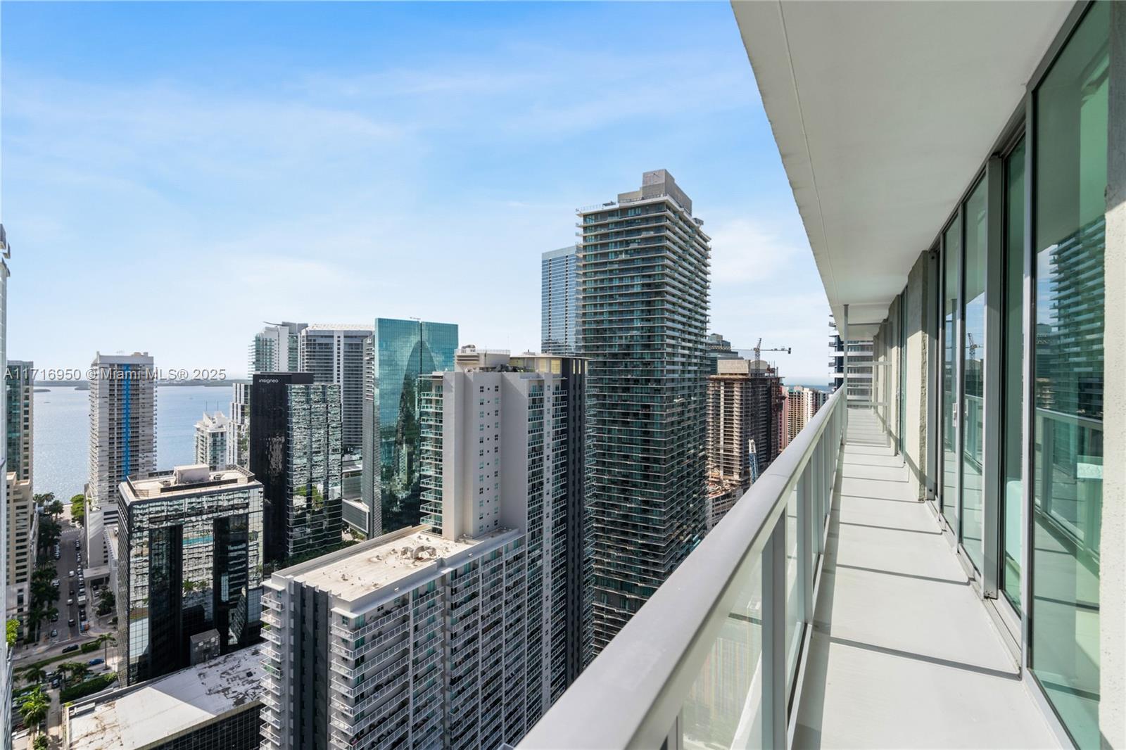 Experience the pinnacle of city living at Unit UPH 4007S in The Axis on Brickell. This spacious two-bedroom, two-bathroom corner penthouse offers breathtaking city and partial bay views, complemented by brand-new motorized window treatments throughout. Newly renovated bathrooms bring a spa-like ambiance, while custom closets provide sleek and functional storage. Two designated parking spaces add convenience in the vibrant heart of Miami. Located within the same building as dining hotspots like Marion, Lafayette Steakhouse, and Coyo Taco, and just steps from Brickell City Centre. Offering a unique blend of luxury, style, and prime location, this home is perfect for those who want to live the ultimate Brickell lifestyle!