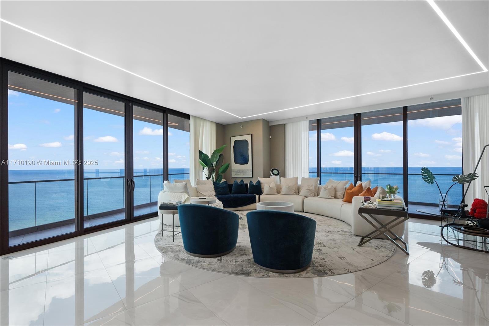 Experience contemporary elegance in this breathtaking corner residence in Sunny Isles Beach.This brand-new 4-bedroom, 5.5-bathroom home offers 3,748 sq. ft. of beautifully designed interiors, plus an additional 1,400 sq. ft. of terraces, for a total of 5,148 sq. ft. Enjoy breathtaking ocean and city views from two expansive terraces, complete with a summer kitchen for seamless outdoor living. The residence boasts floor-to-ceiling windows, a split floor plan, soaring ceilings, and sophisticated finishes curated by the renowned Adriana Hoyos, delivering a sleek, modern design for discerning buyers. Residents enjoy world-class amenities, including a restaurant, 2-story spa, party room, game room, private theater, cigar and wine lounge, kids' playroom, beach cabanas, and even room service