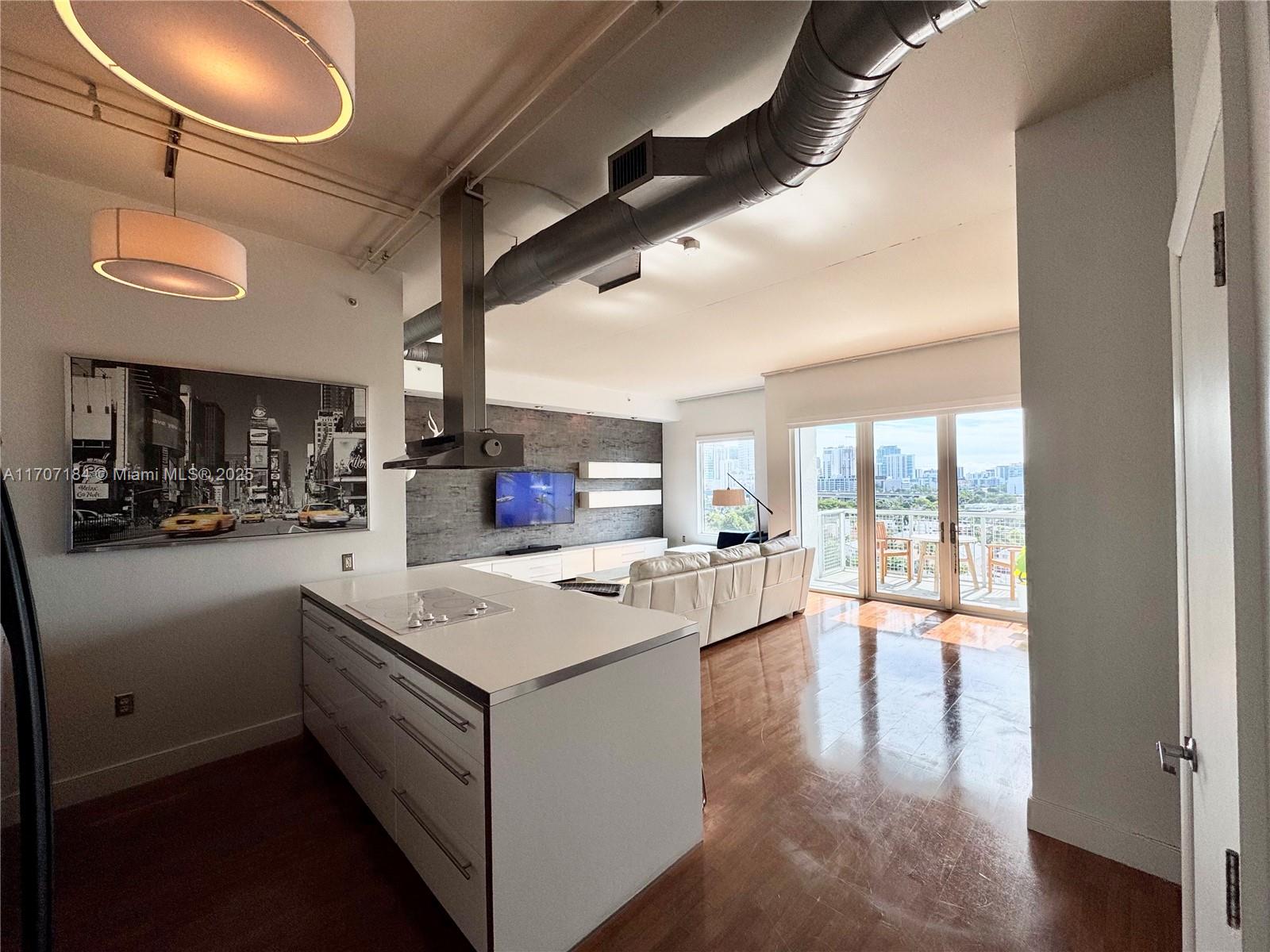 Furnished 2-bed- 2-bath at Neo Lofts with breathtaking views of Downtown, Brickell, and the Miami River. This unit boasts high ceilings, wood floors, and large windows with lots of natural light. Enjoy the open-concept layout, a spacious balcony, stainless steel kitchen appliances and an in-unit washer/dryer. Neo Lots offers resort amenities such as a tennis court, pool, jacuzzi, private dog park, meditation garden, gym, sauna, steam room, business center, 24-hour front desk security, valet parking for guests, and a restaurant at ground level. Located within walking distance to Brickell City Center and a short drive to Downtown Miami, The Design District, Wynwood, Edgewater, Midtown, and South Beach. Just 7 miles from Miami Airport with easy access to I-95.