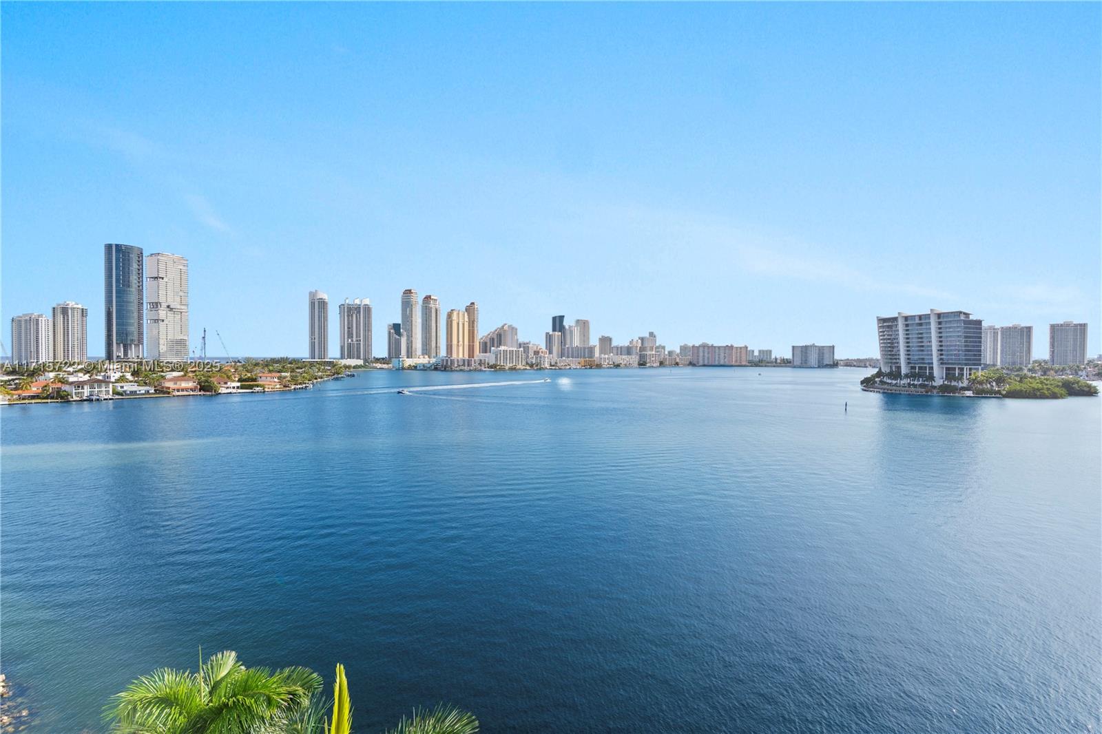 Experience the best line with breathtaking direct Intracoastal views, offering expansive water vistas and unique sunrises and sunsets. This stunning condo features an open, modern kitchen with state-of-the-art appliances, smart home features, floor to ceiling windows, and a seamless integration of ceramic and engineered floors. The spacious primary bedroom boasts an ensuite bathroom with universal shower design and a custom-made walk-in closet. Ample closet space and wrap-around balcony with hurricane shutters. Resort-style amenities such as pickleball, tennis, marina, pool, gym, restaurant, mini-market, lush grounds, private lake, and basketball. Mystic Pointe is located close to houses of worship, Aventura Mall, intl airports, the beach and Bal Harbour Shops. A true waterfront paradise!