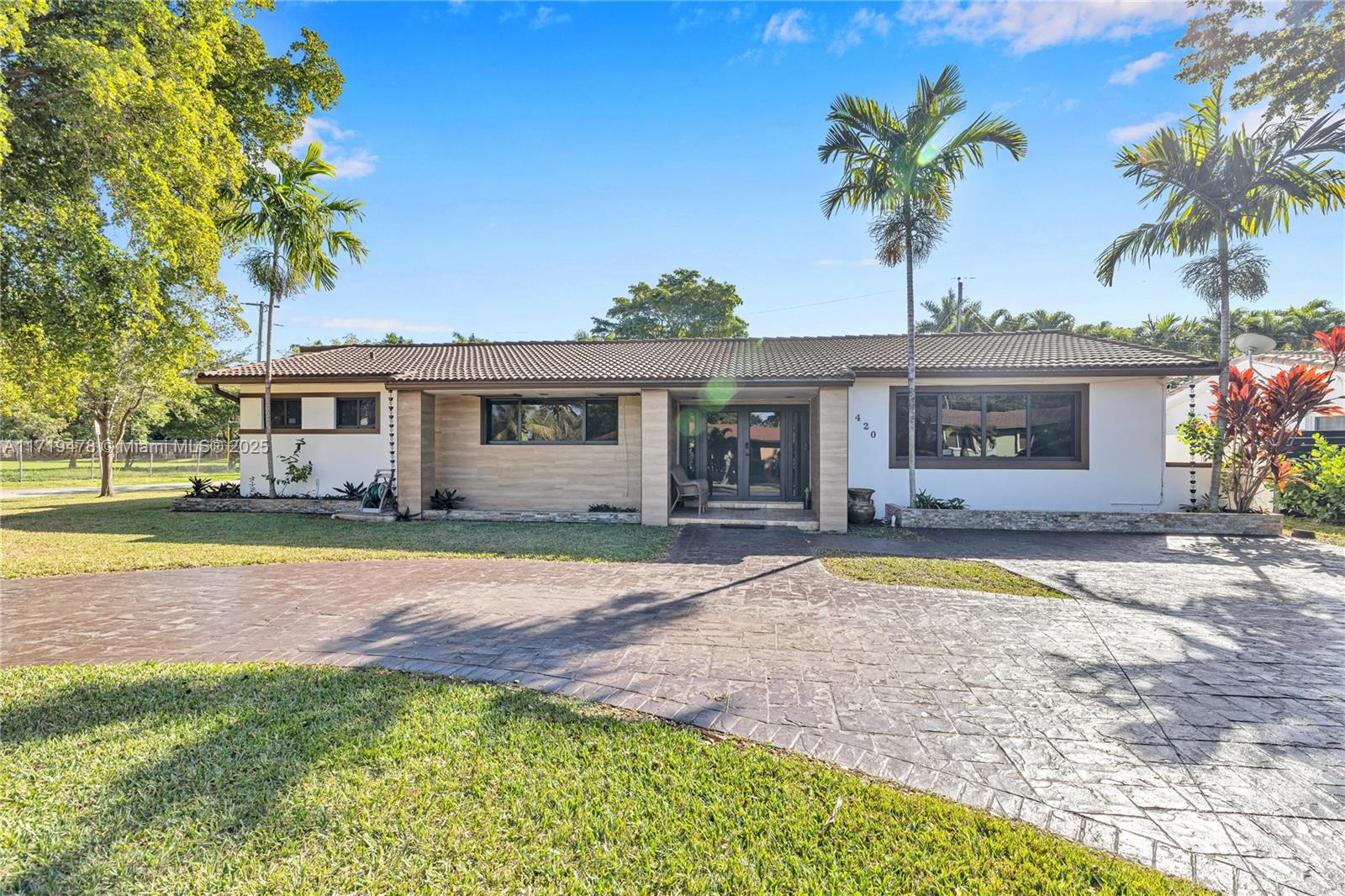 Welcome to this spacious 4-bedroom, 3-bathroom corner home with 2,989 sq. ft. of bright, open living space in one of Miami’s most desirable neighborhoods. Enjoy the ultimate indoor-outdoor living experience with a saltwater pool, hurricane impact windows and doors, a 2023 roof, and upgraded electrical. Perfect for entertaining, the home features two living areas, a sleek granite island kitchen, a built-in bar, and dual A/C with smart thermostats. Two bedrooms open to the pool, while renovated baths, a bonus office, and a surround sound system add modern convenience. Schedule your showing today!