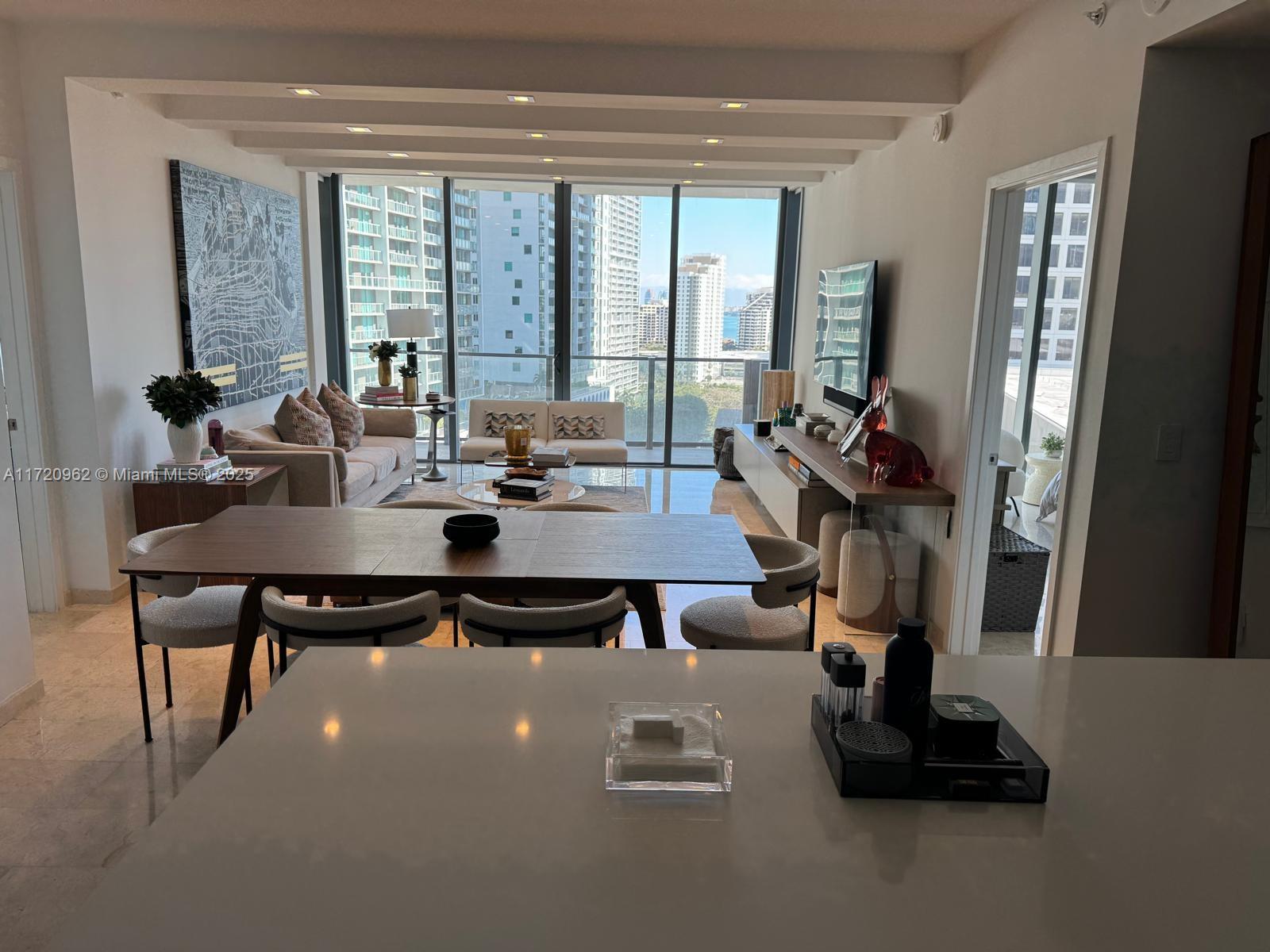 Fully furnished amazing 2 bedroom + den and 2.5 bathrooms. The building has great location: walking distance to metro station, bus station, supermarkets, Brickell City Center, Mary Brickell Village, restaurants and bars. Minutes away from the airport. The building offers many amenities: infinity pool, sauna, steam room, jacuzzi, full equipped three story fitness center, spa, racquetball court, playroom for kids, party room, sports room, theater room, meditation room, business center, gated community that includes a 24hrs and valet parking.