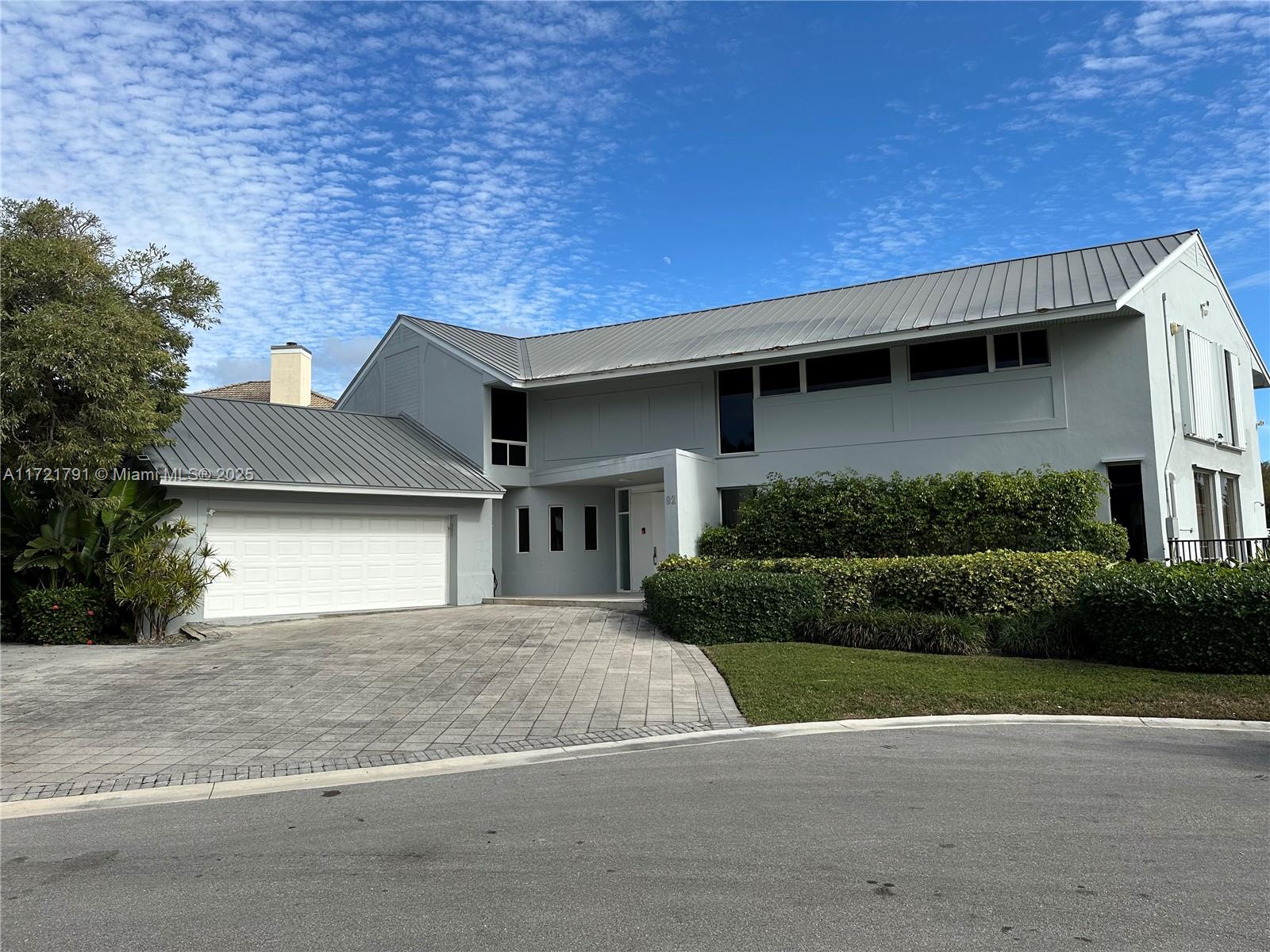 Stunning South-facing Miracle Mile double lot (.6 Acres) with 4100sqft 4 bedroom existing house located on a quiet cul-de-sac in Ocean Ridge. Both 92 Island Drive S. and 93 Island Drive S. are included. Home was built in 1971 and in which the owners have lived for 2.5 years while planning to build on the empty lot. Home is fully functional.  The property features 240ft of seawall with deep water dockage, incl a ski lift. Wide bay views. Seconds from Boynton Inlet and walking distance to the beach.  Full home plans ready for permitting are available for the empty lot, as the owners decided not to build. Ownership also includes access to a private neighborhood beach club.  Build your dream compound on both lots, or keep the lots separate for two development projects.