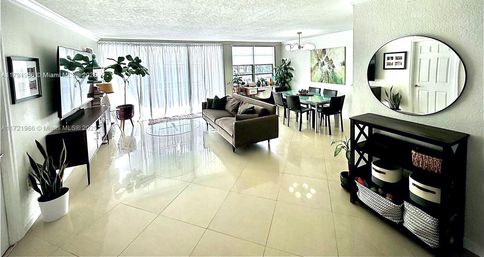 Large, Bright, Spacious, Updated, Corner Unit, with Southern Exposure, in Bay Harbor Islands!! A+ Rated K-8 school, walk to School, Beach, Places of Worship, Bal Harbour Shops, Restaurants. 2 Large Bedrooms + Den. Amenities: Pool, BBQ, Bike Storage, Sauna, Community Room, Basketball and Tennis Courts across the street & EV charging garage 1 block away. Secure Building with Video Intercom. Spacious balcony (7' x 30') with access from both Living Room and Primary Bedroom. 24" tiles throughout and LVP wood floors in bedrooms. Solid Wood Kitchen Cabinets, soft-close doors/drawers, pull outs & lazy susan, Quartz Counters, Newer Appliances, Large Workstation Sink. Extra Storage Room and On-site Maintenance Man. Hot water provided by building - lower FPL bill. Ready to Move In or Rent Out!