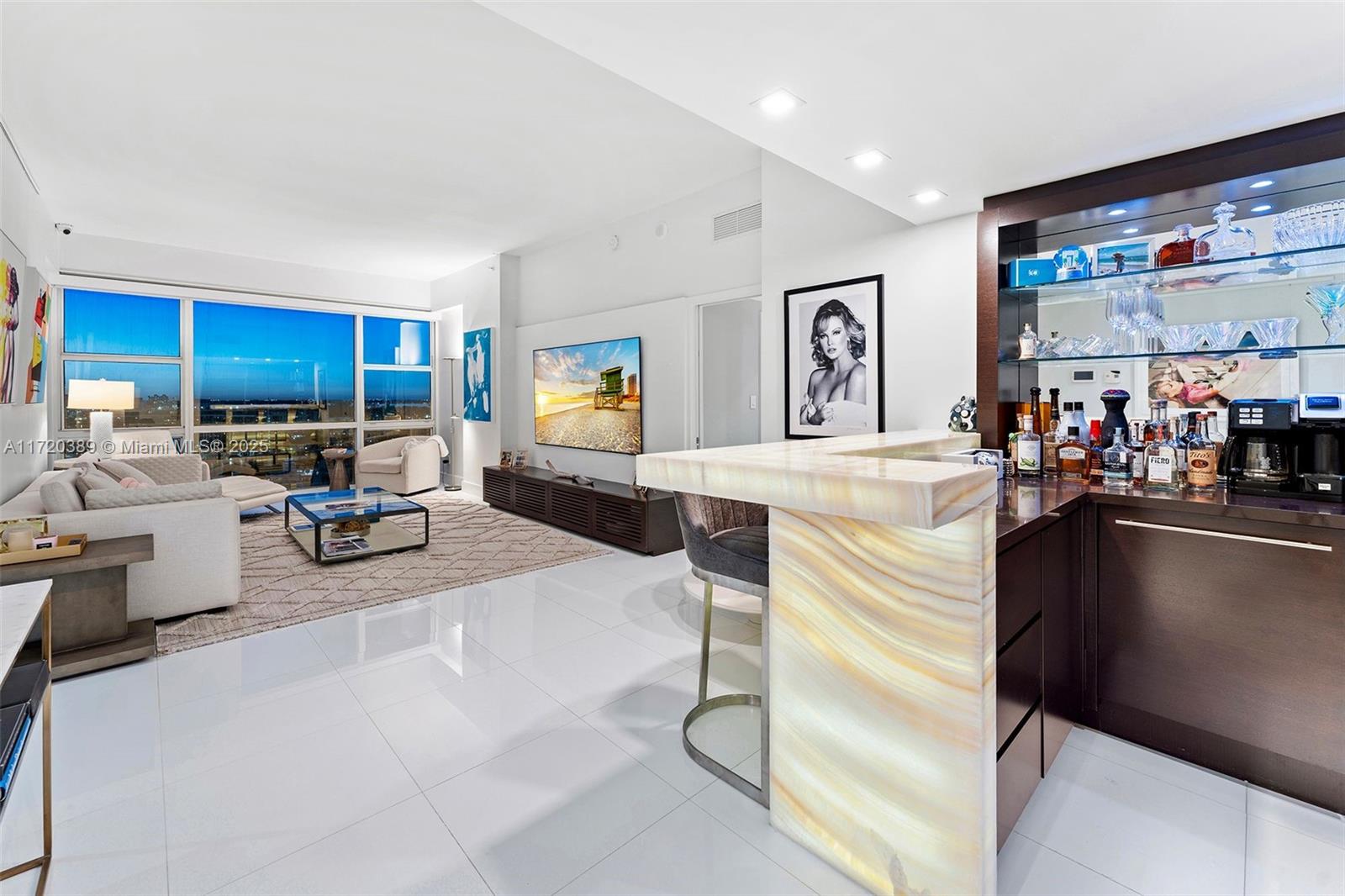 3/3 DOUBLE PENTHOUSE, one-of-a-kind unit w/ sweeping ocean, intercoastal, skyline & pool views w/ high end details, curated art collection, 2 primary suites, 2 separate living spaces, open concept kitchen w/ wine cooler, white onyx full bar w/lighting, tons of custom built-ins for storage. Exquisitely appointed, for entertaining & luxuriating. Experience Penthouse living at the Carillon, rated #1 Wellness property by Conde Nast. 100's classes/week, 70,000 SF Fitness/Spa, hydrotherapy, sauna, steam, energy & regenerative medicine, salon, Fitness, PT & wellness staff, 4 pools, 2 Pilates Studios, water fitness, Gyrotonics, Barre, Zumba, TRX, rock-climbing, concierge, Michelin pop-up restaurant on-site, juice bar, private beach w/food & towel service, 24-hr security, valet, boardwalk.