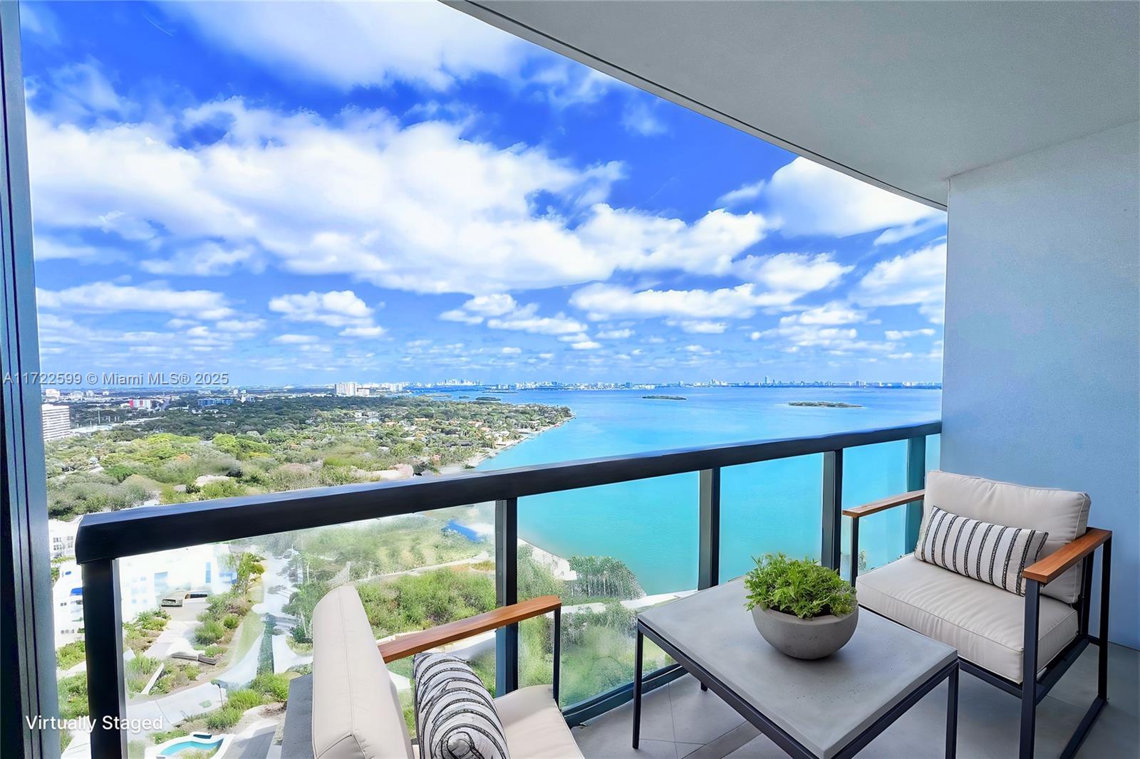 This 2-bedroom, 2.5-bath condo offers 1,158 sq. ft. of contemporary design and stunning Biscayne Bay views from the 25th floor. Features include an open kitchen with quartz countertops, Italian cabinetry, stainless steel appliances, and impact-resistant floor-to-ceiling windows. The spacious layout provides a main bedroom with an en-suite bathroom and walk-in closet, and a private second bedroom with an adjacent bath. Amenities include two heated pools, a spa, sauna, gym, business center, cinema room, BBQ area, and 24-hour valet or self-parking. Located in Edgewater, just minutes from Wynwood, Midtown, and the Design District, this condo offers an unbeatable blend of luxury and convenience.