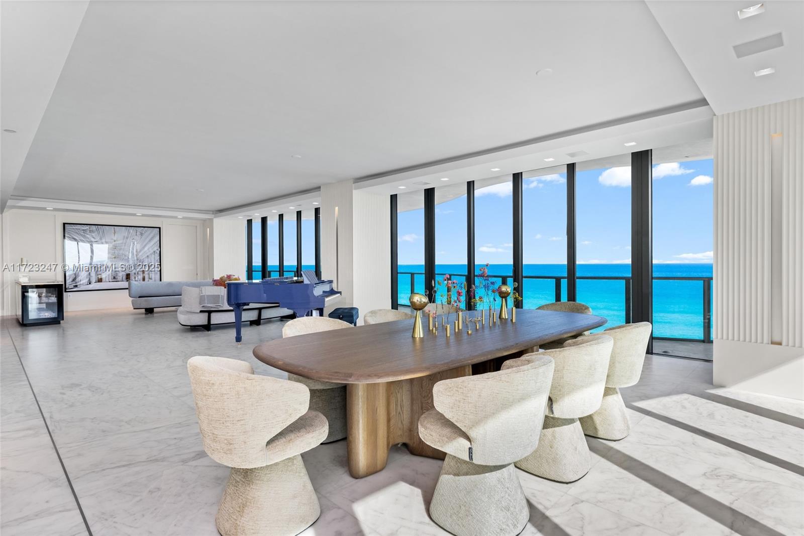 Indulge in the epitome of oceanfront opulence at Regalia On The Ocean No. 6, where 360° panoramic views of the glistening coastline unfold before you. Spanning nearly 5,000 sq ft of masterfully designed living space, this remarkable residence boasts 4 exquisite bedrooms, 5.5 spa-inspired bathrooms, and a vast 2,100 sq ft wraparound terrace. With soaring 10-ft ceilings, floor-to-ceiling windows, and custom marble floors, every detail exudes sophisticated elegance. A cutting-edge smart home, custom lighting, and automated shades enhance the living experience. Exclusive amenities, including a private wine cellar, business center, and world-class spa, redefine luxury living. Schedule your private tour today!