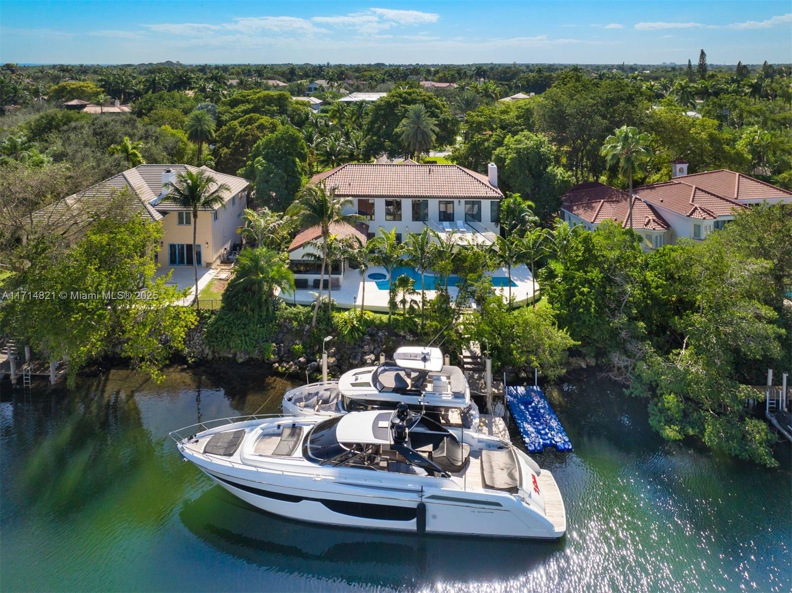 This elegantly redesigned turnkey waterfront masterpiece at 284 Las Brisas in the highly desirable Islands of Cocoplum, with no bridges to Biscayne Bay and direct ocean access, is ideal for boating enthusiasts. Meticulously renovated down to the studs, it features a brand-new dock, full-home generator and accommodates a 100-foot yacht. Perfect for hosting unforgettable gatherings, the home seamlessly blends sophisticated style with modern functionality. Cocoplum residents enjoy 24/7 police patrol, private club amenities, and proximity to elite schools, luxury boutiques, and fine dining, epitomizing unmatched elegance and convenience along with waterfront luxury.