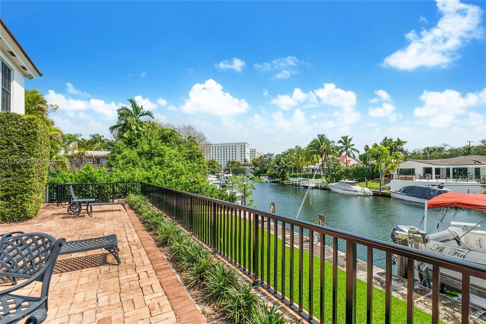 Offered for the first time by the original family since property's 1967 construction! Rare opportunity to own a unique waterfront duplex on a 12,000 sq. ft. lot with an 80-foot BOAT DOCK and ocean access via three fixed bridges. This charming property features Chicago brick design, blending historic character with modern updates. Each renovated 2,100 sq. ft. unit offers 2 bedrooms, 2.5 baths, granite-counter kitchens, bright sunrooms, and waterfront patio. The 2025 roof, separate laundry rooms, and circular driveway with majestic tree add convenience. With the upstairs unit rented, it provides immediate income potential. Ideal for investors or multigenerational living, this property offers a luxurious Coral Gables waterfront lifestyle. Sale price includes both units (MLS A11723035).