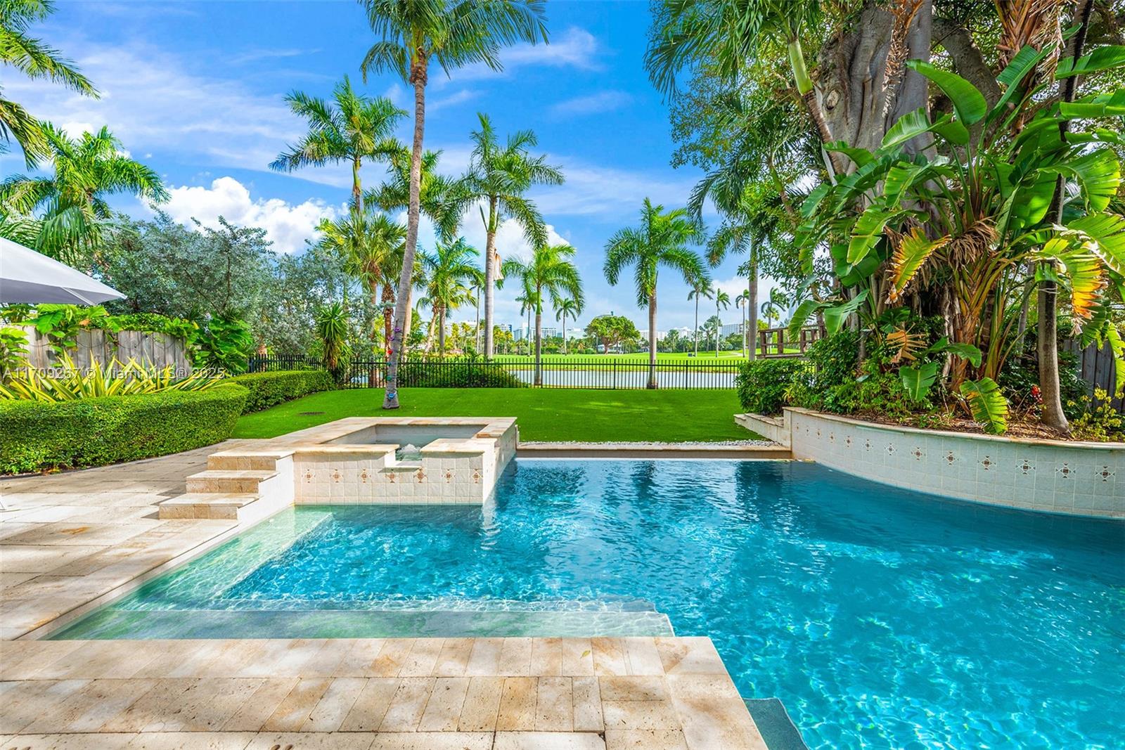 LOWEST PRICE PER SQ.FT. ON ALTON RD WITH A POOL & GORGEOUS LGCC GOLF COURSE VIEWS! This home is situated in front of the course's grand water feature, creating a serene backdrop. Inside, find chic remodeled interiors, impact windows/doors, a fireplace, a custom eat-in kitchen w/ wine fridge, & a functional floor plan w/ 4 bedrms upstairs & 1 down. The huge backyard oasis has a heated pool & spa, built-in summer kitchen, retractable awning, artificial turf & lush mature landscaping. 1-car garage + carport. One of the few homes to have purchased a perpetual land easement from the golf club, expanding its footprint beyond the tax roll. Located in the heart of Miami Beach mins to highways, A schools, shopping, dining, Fisher Park & beaches!