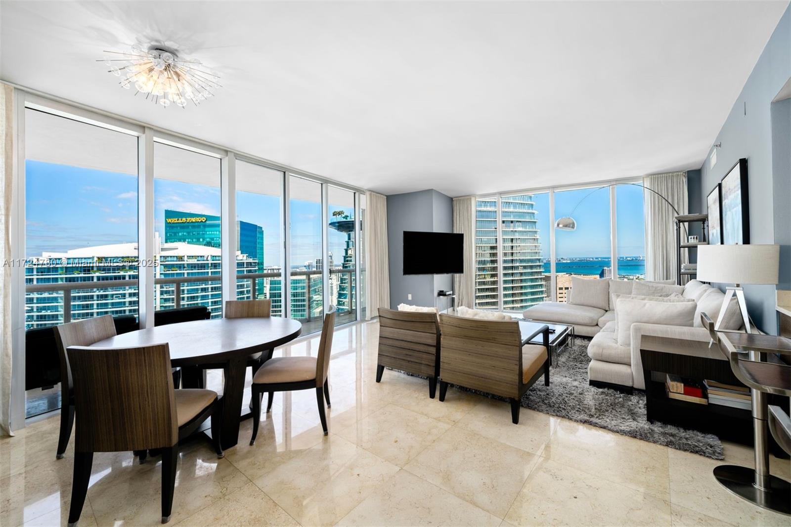 A magnificent 2 Bedroom, 2 Bath condo at Icon Brickell Tower 1 featuring marble flooring throughout the main living areas, wood flooring in both bedrooms, high-end kitchen appliances by Wolf & Sub-Zero, and 10-foot-high ceilings w/ sweeping views of the bay, city, ocean, and river from the 53rd floor. Building amenities include a two-acre pool deck with a 50-person hot tub and 300-foot-long swimming pool, a state-of-the-art fitness center, full-service spa with sauna and steam rooms, on-site restaurants, 24-hour valet parking, and 24-hour concierge service. Icon Brickell is within walking distance of Whole Foods, Silverspot Cinema, Mary Brickell Village, and Brickell City Centre.