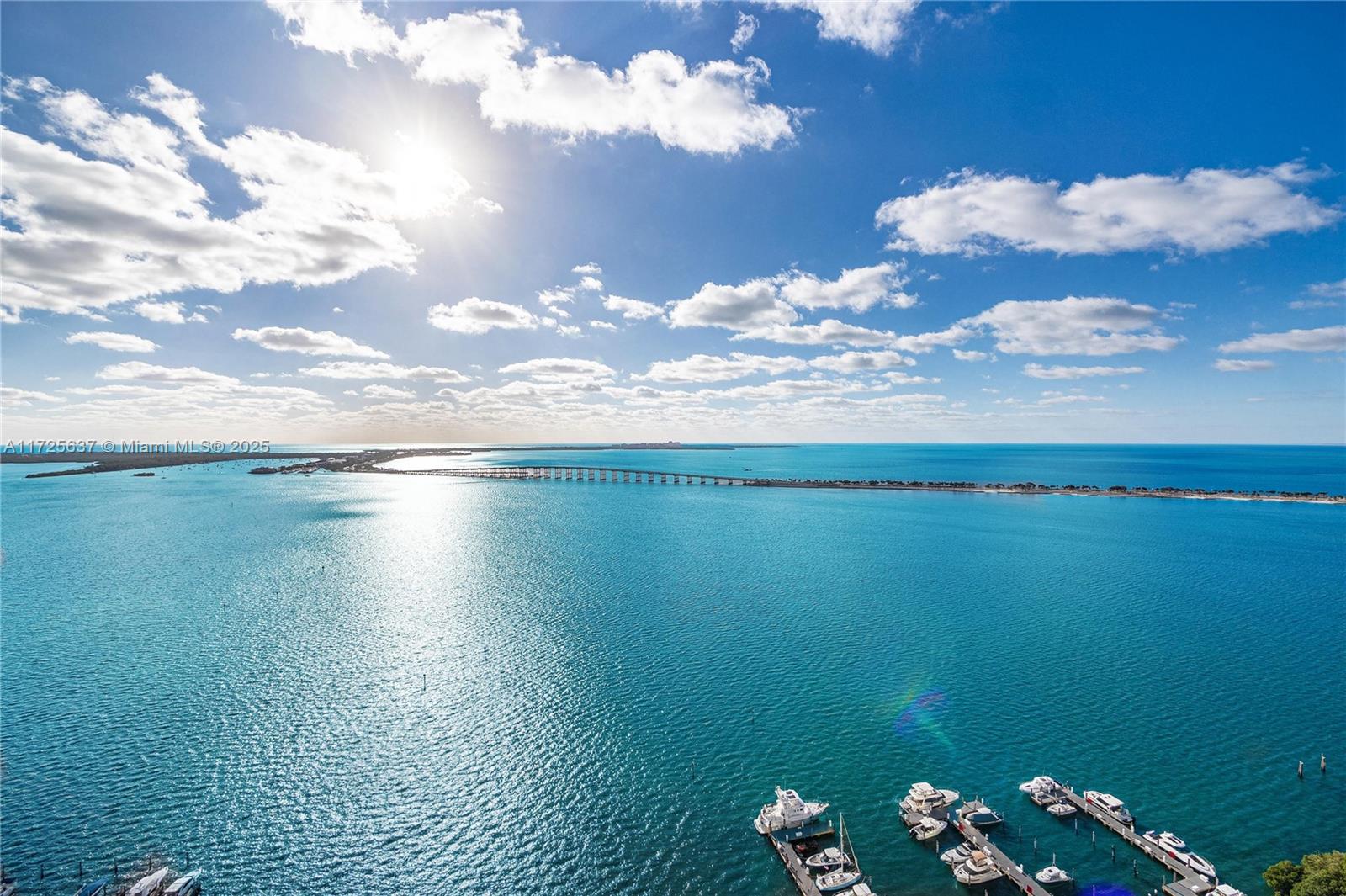 This exquisite 2-bedroom, 2-bathroom residence offers an expansive 1,640 square feet of beautifully designed living space, tailored for both comfort and style. Floor-to-ceiling windows flood the interiors with natural light, while offering breathtaking views of the iconic Miami skyline and the shimmering waters of Biscayne Bay. Step out onto your private balcony and immerse yourself in the beauty of the surrounding cityscape and waterfront, creating an ideal space for relaxation or entertaining guests. The building features rare amenities, including two tennis courts, a large pool deck over looking the water, and a fully-equipped gym, providing an exceptional lifestyle in one of Miami’s most desirable locations.