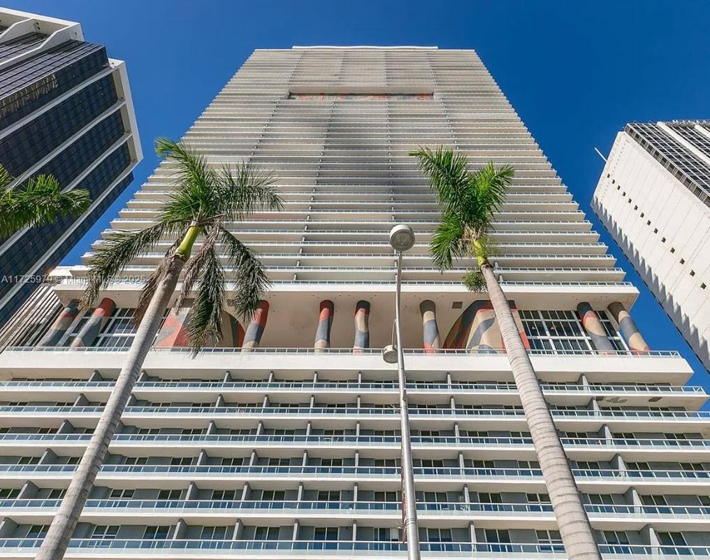 Elevate Your Waterfront Lifestyle. Discover refined living in this spacious 3-bedroom, 2-bathroom corner residence at the iconic 50 Biscayne in downtown Miami. With wood flooring and floor-to-ceiling windows, this home showcases breathtaking views of Biscayne Bay. The master suite offers dual vanities, a glass-enclosed shower, a soaking tub, and two walk-in closets, with direct access to a private balcony. The open-concept living area flows seamlessly onto a 400 wrap-around balcony, perfect for elegant entertaining or serene relaxation.
Residents enjoy exclusive amenities, including a fitness center, spa, resort-style pool, and 24-hour concierge. Located steps from Miami’s finest dining, shopping, and cultural attractions, this home offers the ultimate urban lifestyle.