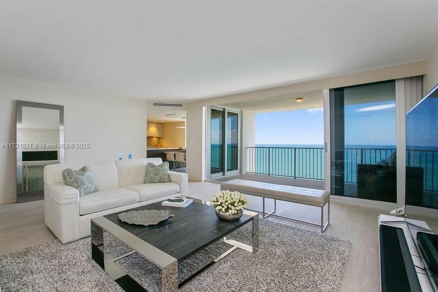 THIS IS A PERFECT SOUGHT-AFTER PENTHOUSE WITH DIRECT ATLANTIC OCEAN AND BISCAYNE BAY VIEWS FOREVER. TOTALLY AND COMPLETELY REMODELED IN THE BEST OF TASTE! ELEGANT PORCELAIN FLOORS THROUGHOUT THIS 2 BEDROOM, 2 BATH HOME. CUSTOM FINISHES INCLUDE:ITALIAN (ARAN) CLOSETS, ITALIAN (CASABATH) BATHROOM CABINETRY, ITALIAN (BINOVA) KITCHEN CABINETRY, QUARTZITE COUNTERS, SUBZERO WINE FRIDGE, MIELE APPLIANCES, FULL SIZE WASHER AND DRYER AND ON DEMAND WATER HEATER. ALL WINDOWS AND DOORS ARE IMPACT GLASS. WIDE PRIVATE BALCONY OPEN TO THE OCEAN BREEZES. SEMI-PRIVATE (NO LONG HALLWAYS) ELEVATOR FOYER, ONLY ONE NEIGHBOR. SPRINLER SYSTEM ALREADY INSTALLED. NO ASSEMENTS. HEATED POOLS, 2 LIGHTED CLAY TENNIS COURTS, HALF BASKETBALL COURT, SAUNA, GYM, BEACH WITH CHAIRS AND UMBRELLAS AND OCEAN. EASY TO SHOW.