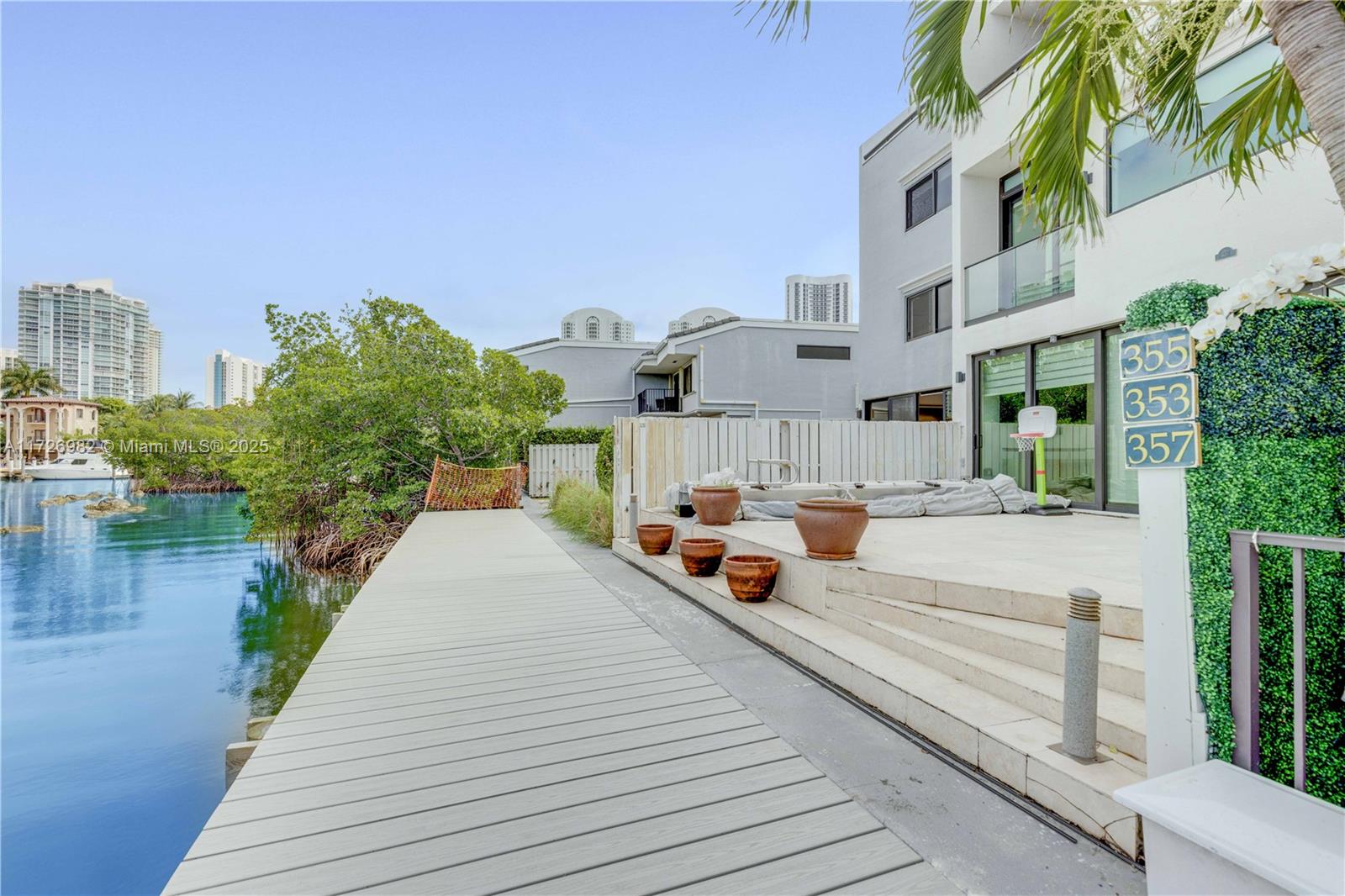 Welcome to this waterfront townhouse in Sunny Isles Beach, which offers direct access to the Intracoastal Waterway. The first floor opens to a charming patio with water view, also offers a studio with a spacious closet, ideal for a home office or guest room. Marble floors throughout the home. Upstairs, the property boasts three spacious bedrooms with walk-in closets. The second floor also features two unique balconies with spectacular views. The complex offers private access, tennis courts, two swimming pools, a private marina, and is surrounded by abundant, well-maintained green areas. The beach is just across the street. Located in a community with top-rated A schools. The unit is vacant and easy to show.