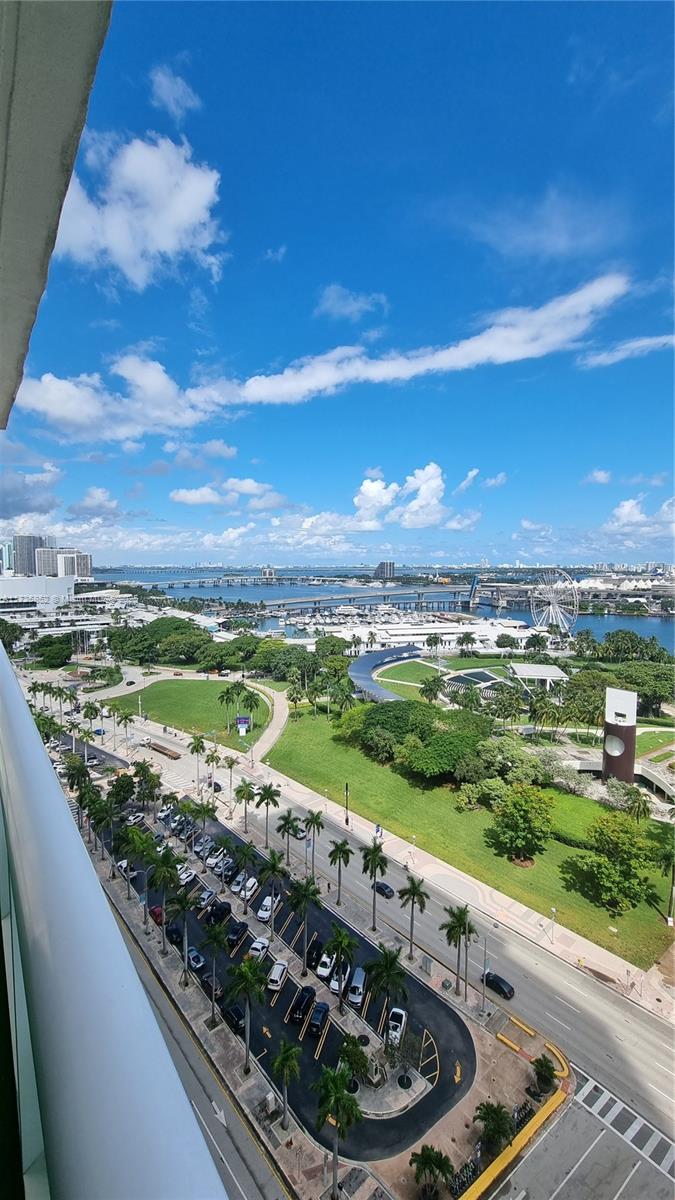 Indulge in the epitome of Miami luxury living in this exquisite residence boasting breathtaking panoramic views of Biscayne Bay. This  corner unit offers a spacious wraparound terrace where you can sip your morning coffee while soaking in the sunrise. The split floor plan features 3 bedrooms and 2 baths, including a luxurious master suite. Entertain guests in style in the open-concept kitchen,  floor-to-ceiling hurricane impact windows. Enjoy a 24-hour concierge, state-of-the-art fitness center, sauna, infinity pool, jacuzzi, cabanas, and a social room. Immerse yourself in the vibrant energy of Downtown Miami with easy access to world-class dining, shopping, and entertainment. Steps away from Miami World Center, Kaseya Center, Brickell City Center, Whole Foods, and Bayside Marketplace