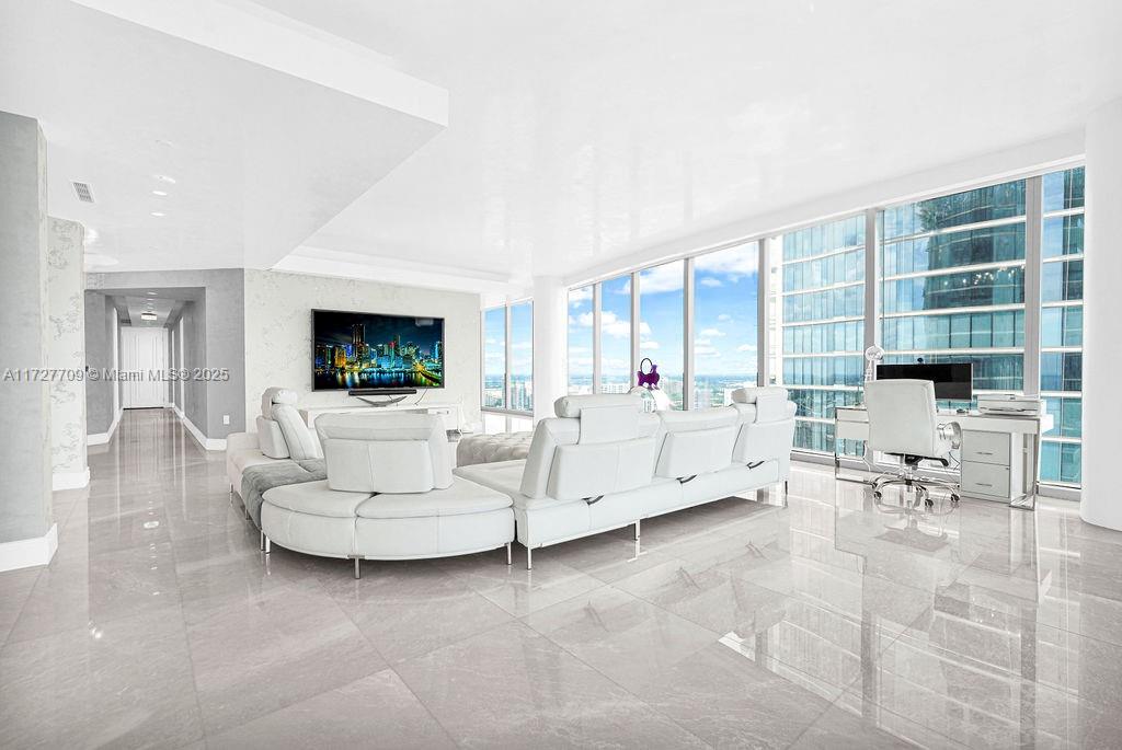 Welcome to the prestigious Estates at Acqualina, featuring a stunning NE corner unit with 4 bedrooms, 6.1 bathrooms, and a maid's room. This 5,222 sq. ft. residence offers breathtaking views of the ocean, bay, and skyline, with 1,000 sq. ft. of outdoor living space, complete with separate sunrise and sunset balconies, an oceanfront sauna, spa, and private BBQ. Inside, enjoy 10.6-foot ceilings, a chef's kitchen with top-tier appliances, and a grand primary suite with dual bathrooms and an oversized Italian leather closet. The building's luxurious amenities include 5 restaurants, 3 pools, a Rolls-Royce house car, a cinema, bowling alley, , water slide, golf simulator, soccer, basketball, Ice skating and more.