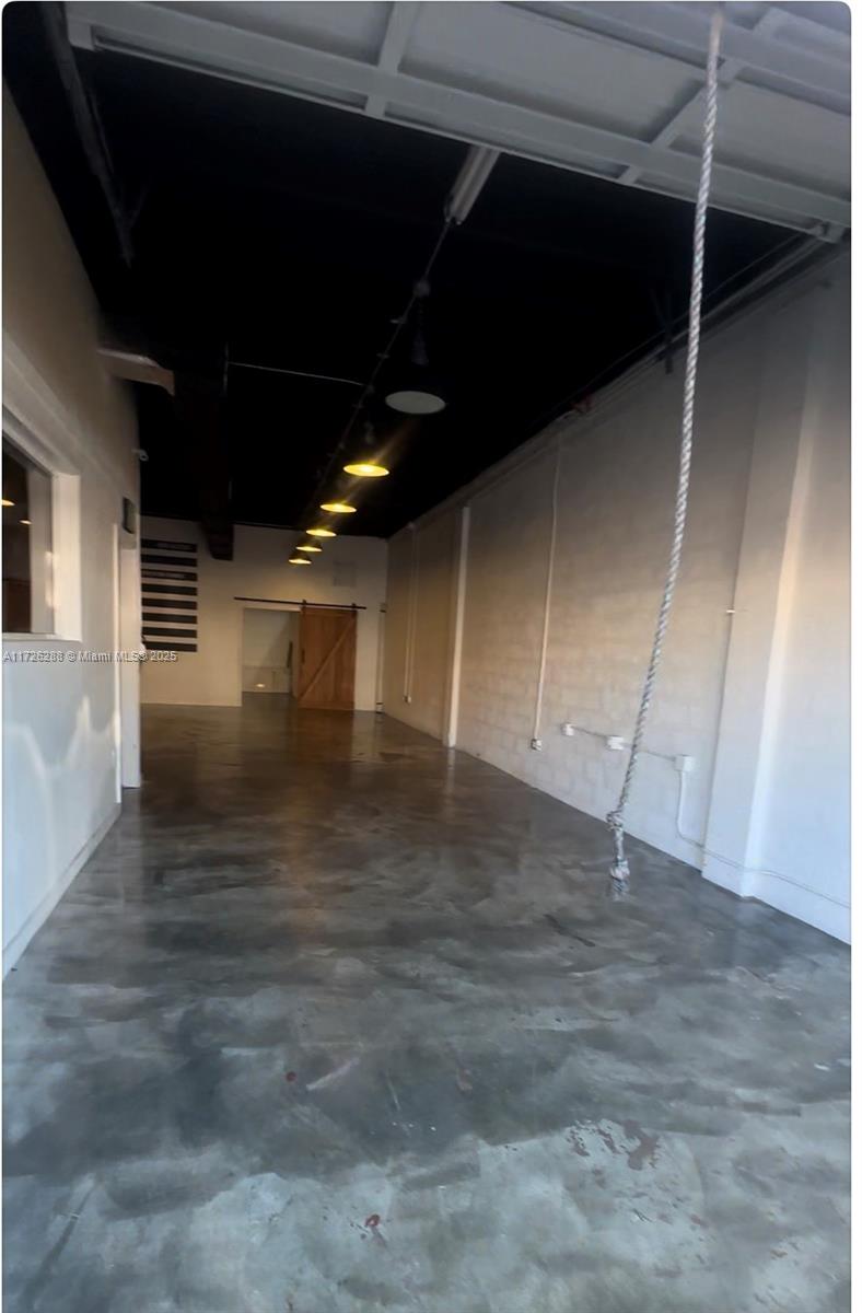 Spacious warehouse in the heart of South Miami near US1 & 874. $25/sqft Tripple Net - CAM is approx. $5.80/sqft and includes water/waste/sales tax/Insurance.  Unit has two (2) assigned parking spaces.